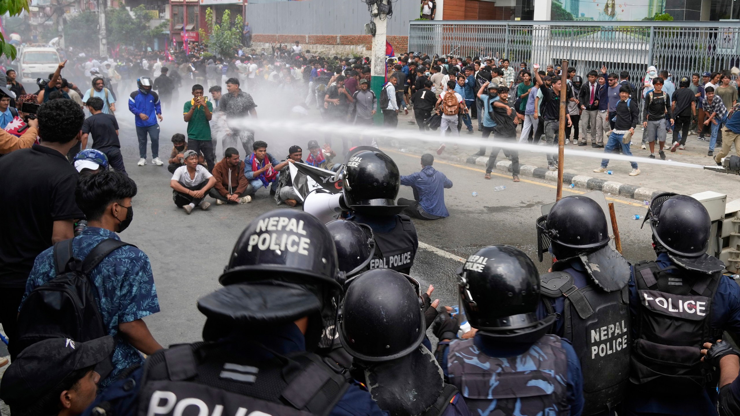 Riot police use water cannon on protesters during clashes outside parliament building in Kathmandu, Nepal, Monday, Sept. 8, 2025. (AP Photo/Niranjan Shrestha)