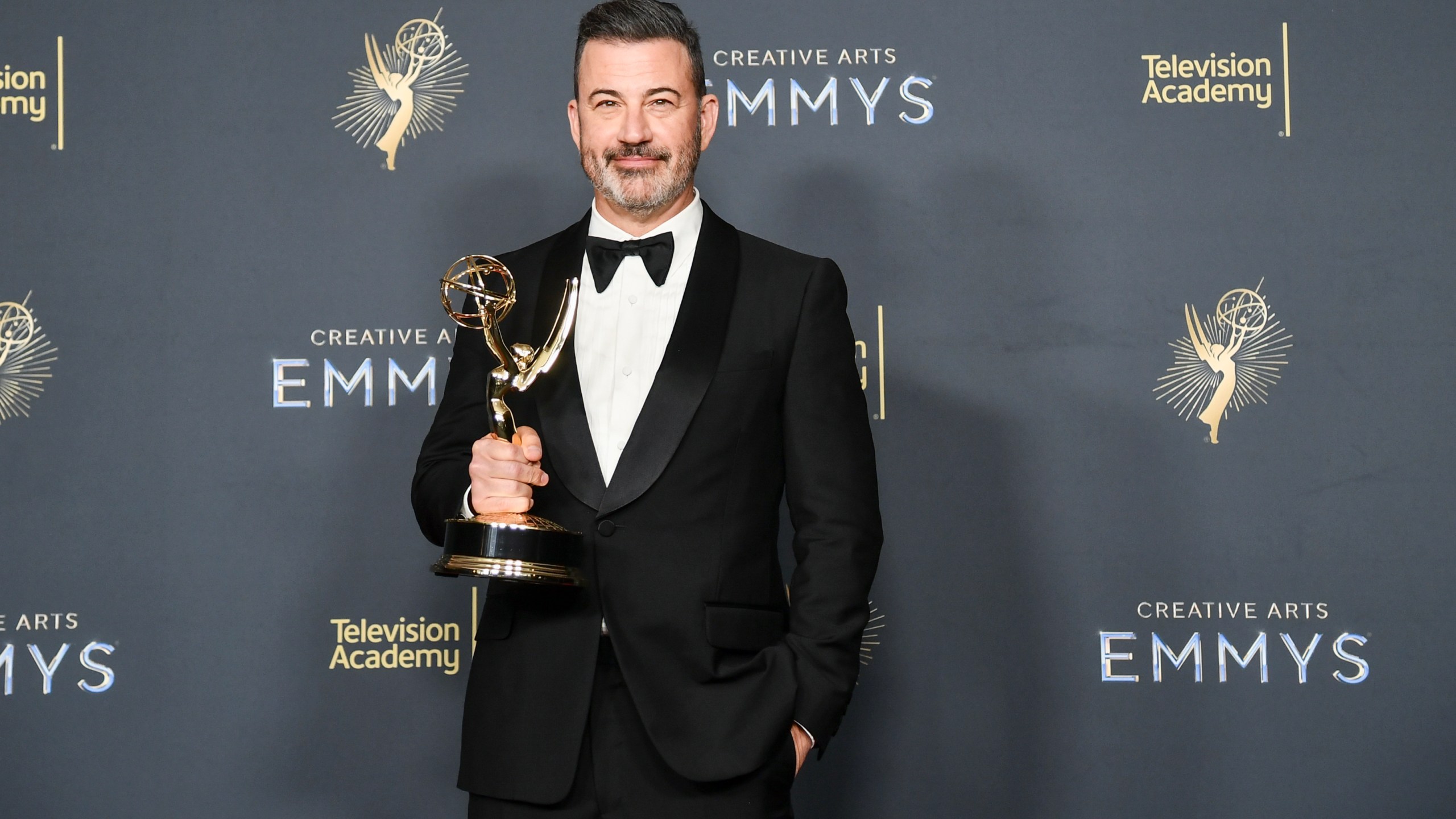 Jimmy Kimmel poses in the press room with the award for host for a game show for "Who Wants to Be a Millionaire" during night two of the Creative Arts Emmy Awards on Sunday, Sept. 7, 2025, at the Peacock Theater in Los Angeles. (Photo by Richard Shotwell/Invision/AP)