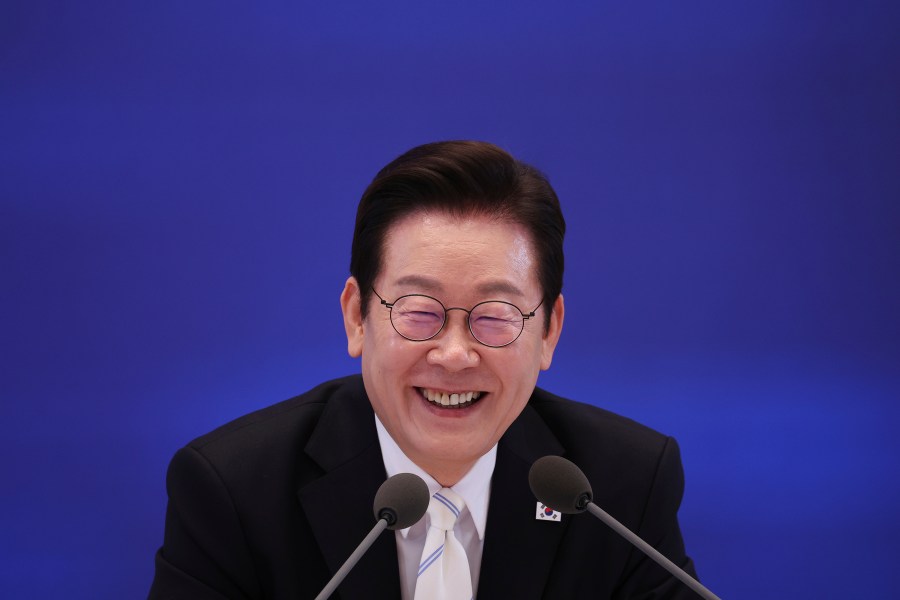 South Korean President Lee Jae Myung reacts during a news conference to mark 100 days in office at the Blue House in Seoul, South Korea, Sept, 11, 2025. (Kim Hong-Ji/Pool Photo via AP)