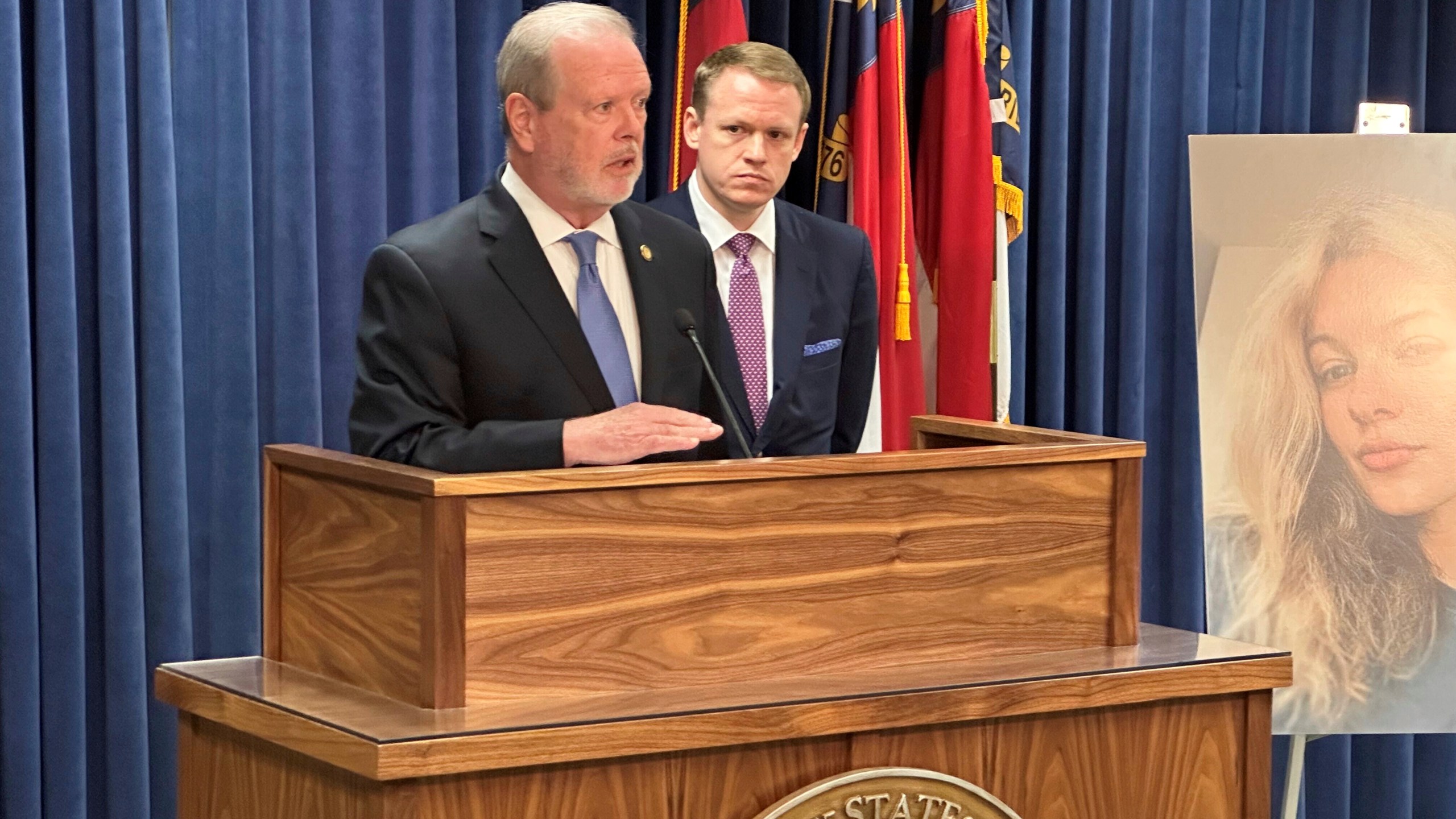 North Carolina state Senate leader Phil Berger, R-Rockingham, left, speaks while House Speaker Destin Hall, R-Caldwell, listens and stands next to a photo of commuter train stabbing victim Iryna Zarutska, during a Legislative Building news conference, in Raleigh, N.C., Thursday, Sept. 11, 2025. (AP Photo/Gary D. Robertson)