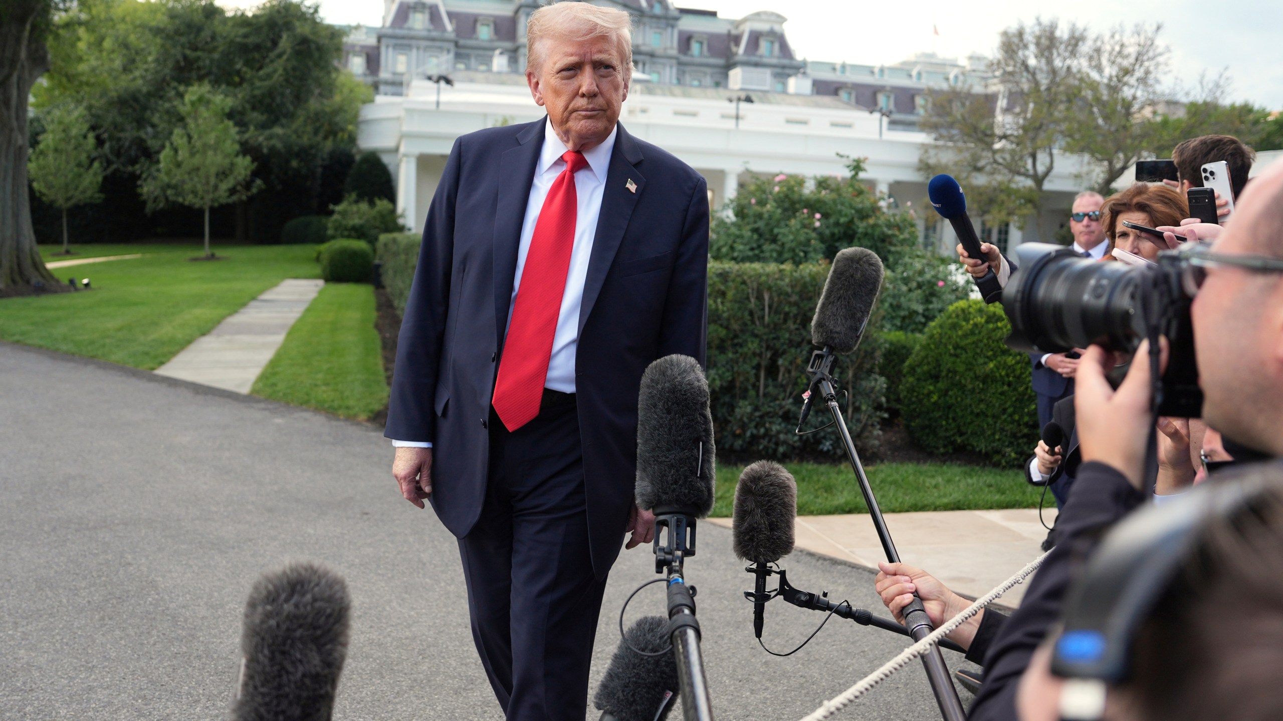 President Donald Trump speaks with reporters before boarding Marine One on the South Lawn of the White House, Thursday, Sept. 11, 2025, in Washington. (AP Photo/Evan Vucci)
