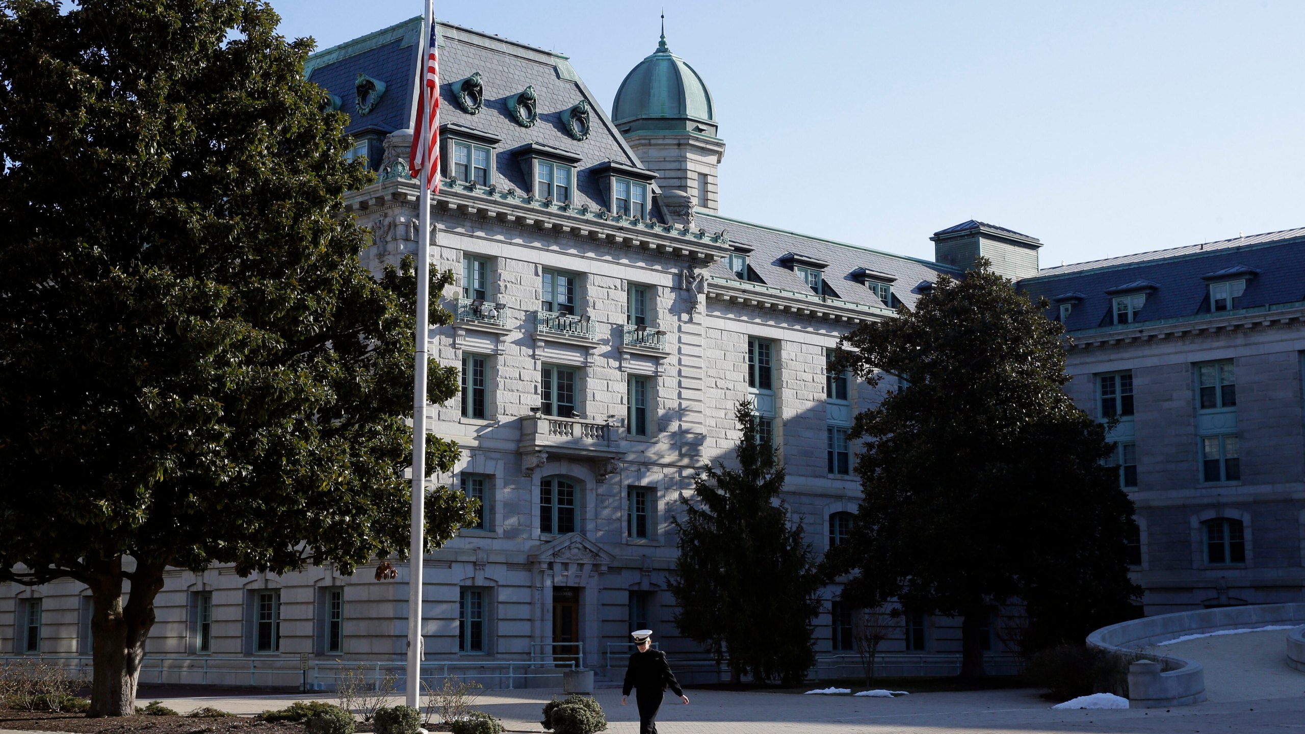 FILE - A midshipman walks outside of Bancroft Hall, the main dormitory on the U.S. Naval Academy campus, in Annapolis, Md., Jan. 9, 2014. (AP Photo/Patrick Semansky, File)