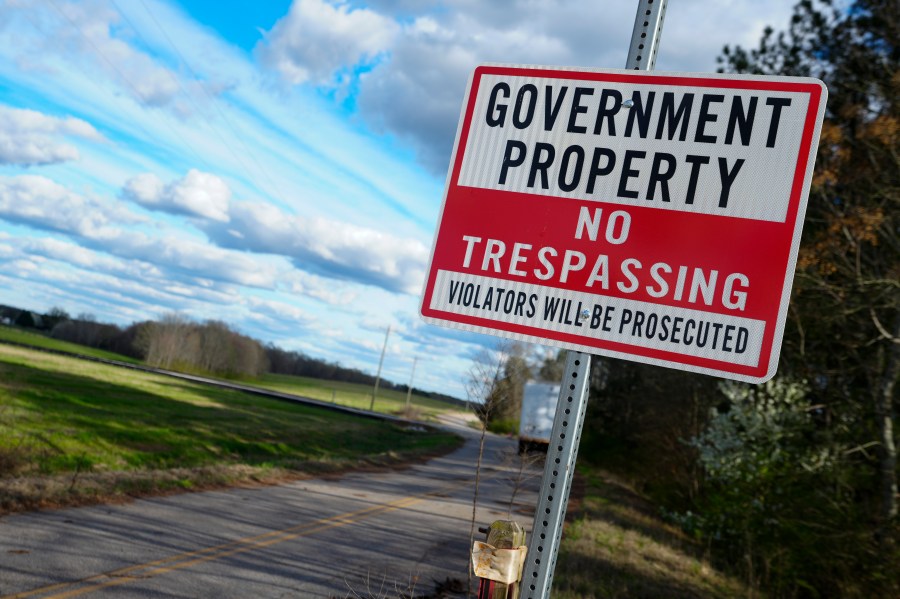 FILE - A sign warns against trespassing on government property at the site of a planned Rivian electric truck plant March 7, 2024, in Rutledge, Ga. (AP Photo/John Bazemore, File)