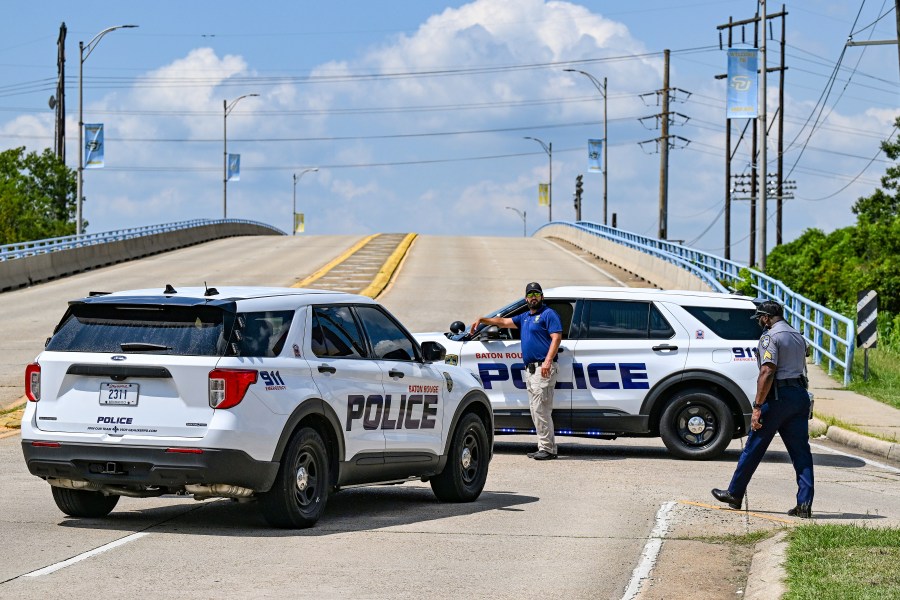 Baton Rouge Police block the entrance of Southern University's campus at the corner of Harding Boulevard and Scenic Highway, Thursday, Sept. 11, 2025, after a threat led administers to announce a lockdown, in Baton Rouge, La. (Javier Gallegos/The Advocate via AP)