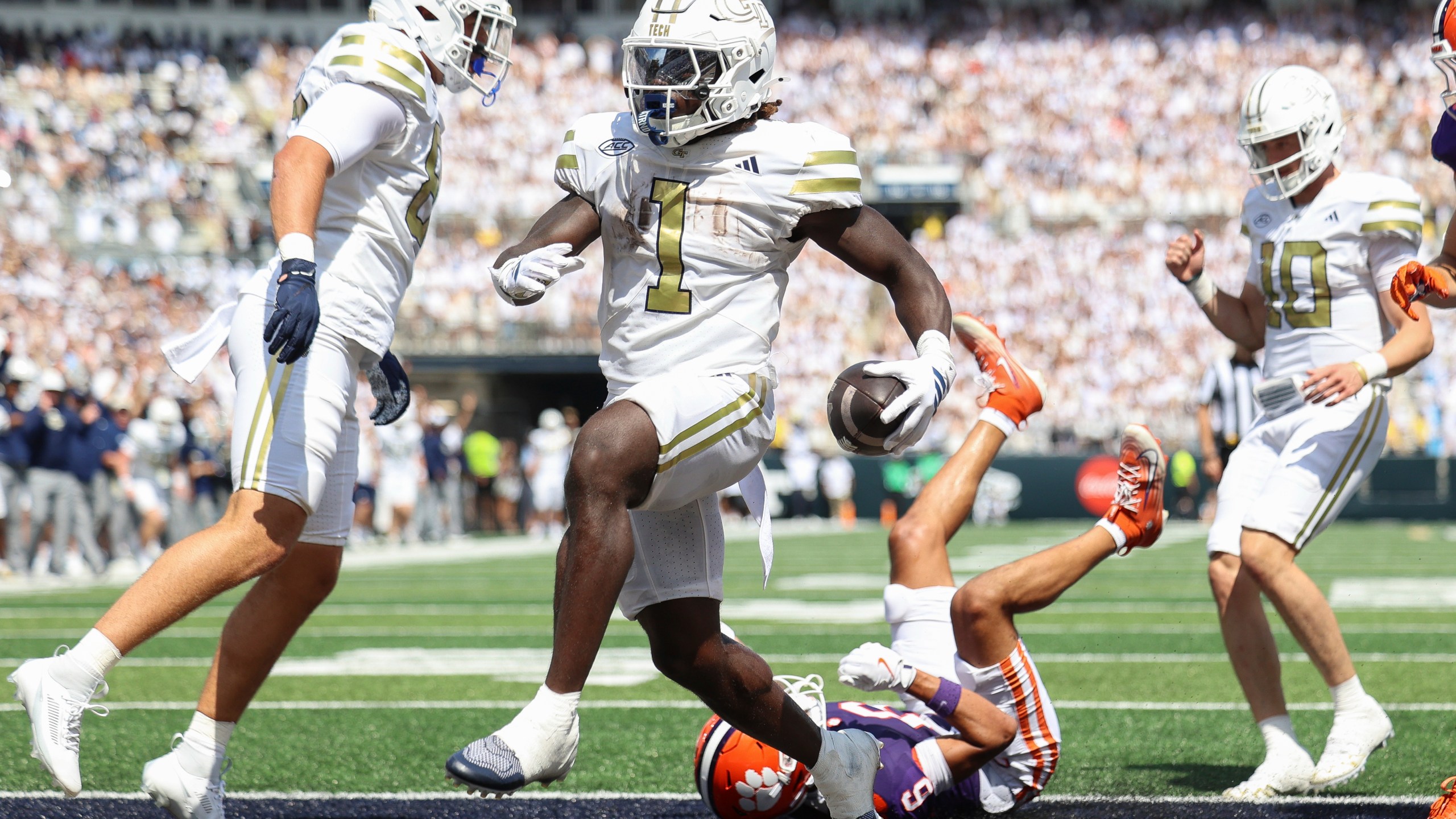 Georgia Tech running back Jamal Haynes (1) scores a touchdown during the first half of an NCAA college football game against Clemson, Saturday, Sept. 13, 2025, in Atlanta. (AP Photo/Colin Hubbard)