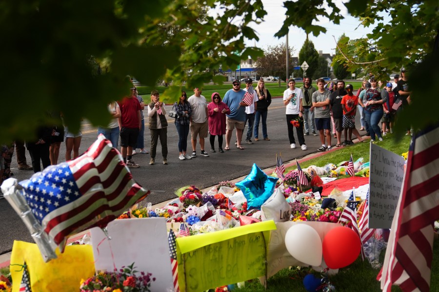 Supporters gather at a makeshift memorial in Orem, Utah, Saturday, Sept. 13, 2025, at Utah Valley University for Turning Point USA CEO and co-founder Charlie Kirk who was fatally shot during an event on the campus. (AP Photo/Lindsey Wasson)