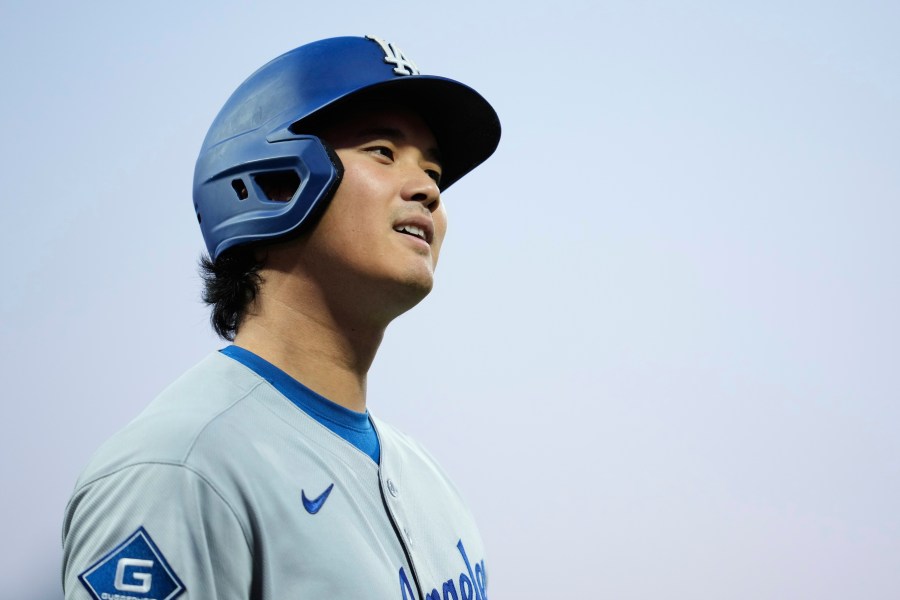 Los Angeles Dodgers' Shohei Ohtani walks to the dugout after being called out on strikes during the fourth inning of a baseball game against the San Francisco Giants, Saturday, Sept. 13, 2025, in San Francisco. (AP Photo/Godofredo A. Vásquez)
