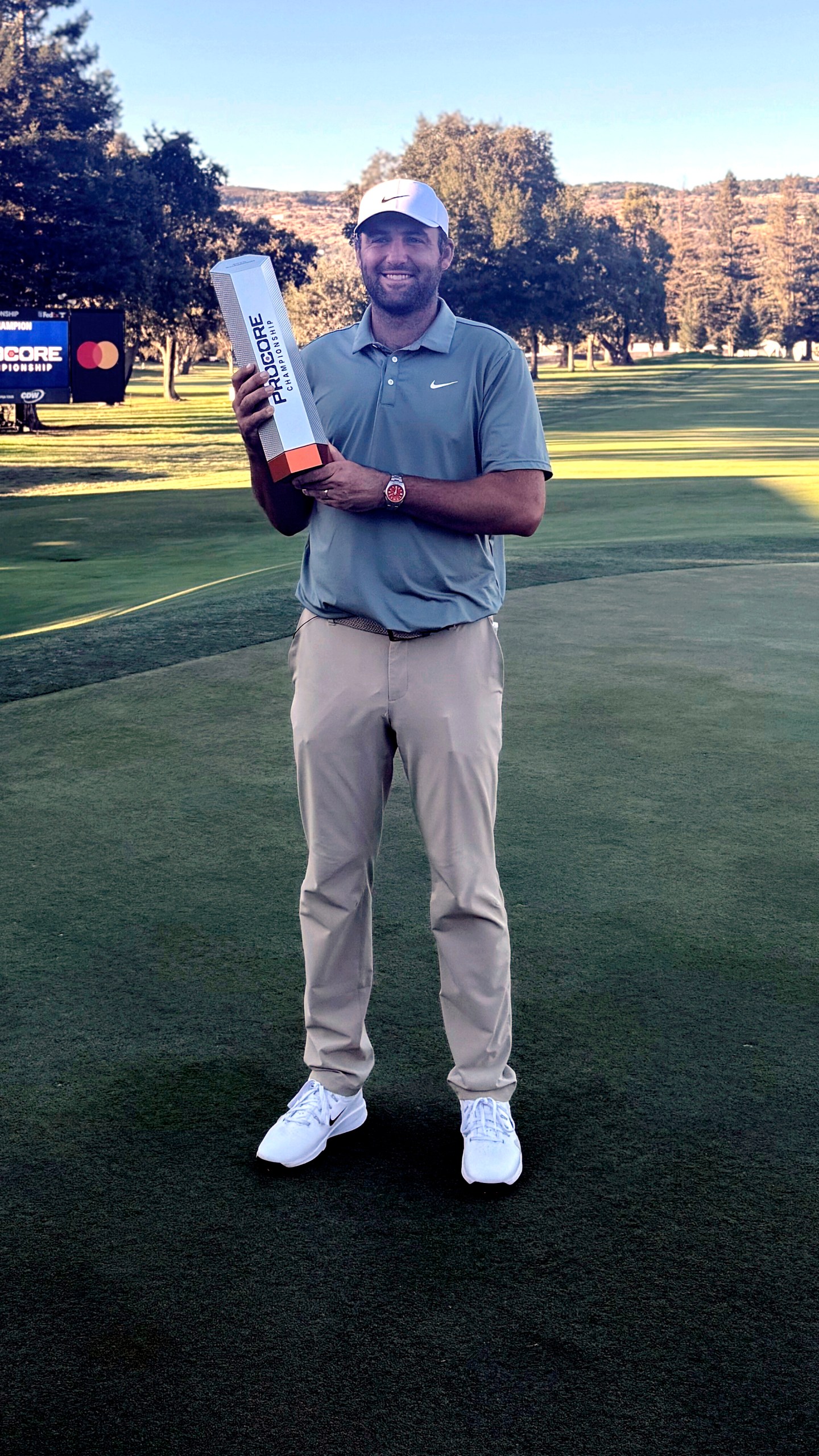 Scottie Scheffler holds the trophy after winning the Procore Championship on Sunday, Sept. 14, 2025, at Silverado Resort in Napa, California, for his sixth PGA Tour title of the year. (AP Photo/Doug Ferguson)