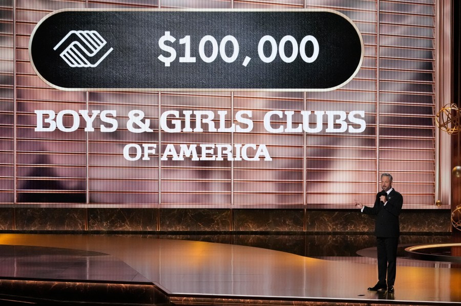Host Nate Bargatze pleges a donation during the 77th Primetime Emmy Awards on Sunday, Sept. 14, 2025, at the Peacock Theater in Los Angeles. (AP Photo/Chris Pizzello)