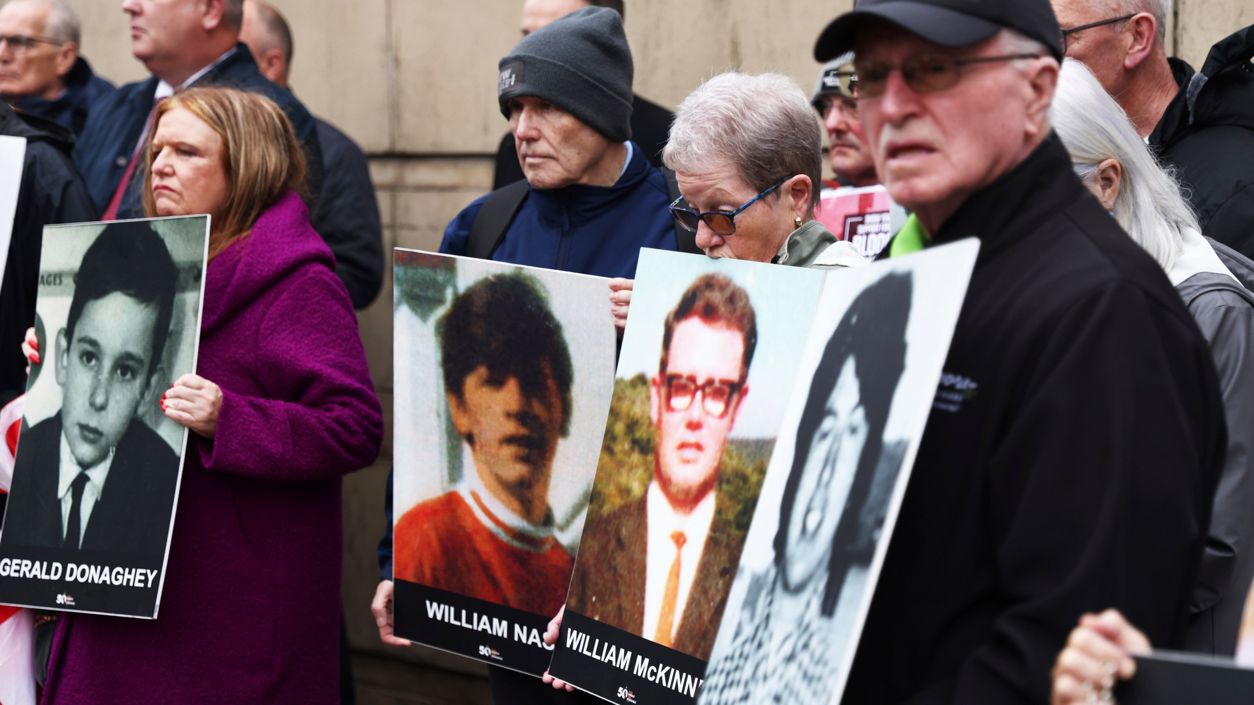 Families of the victims of the 1972 Bloody Sunday, hold a protest outside Belfast Crown court, Northern Ireland, Monday Sept. 15, 2025. (AP Photo/Peter Morrison)