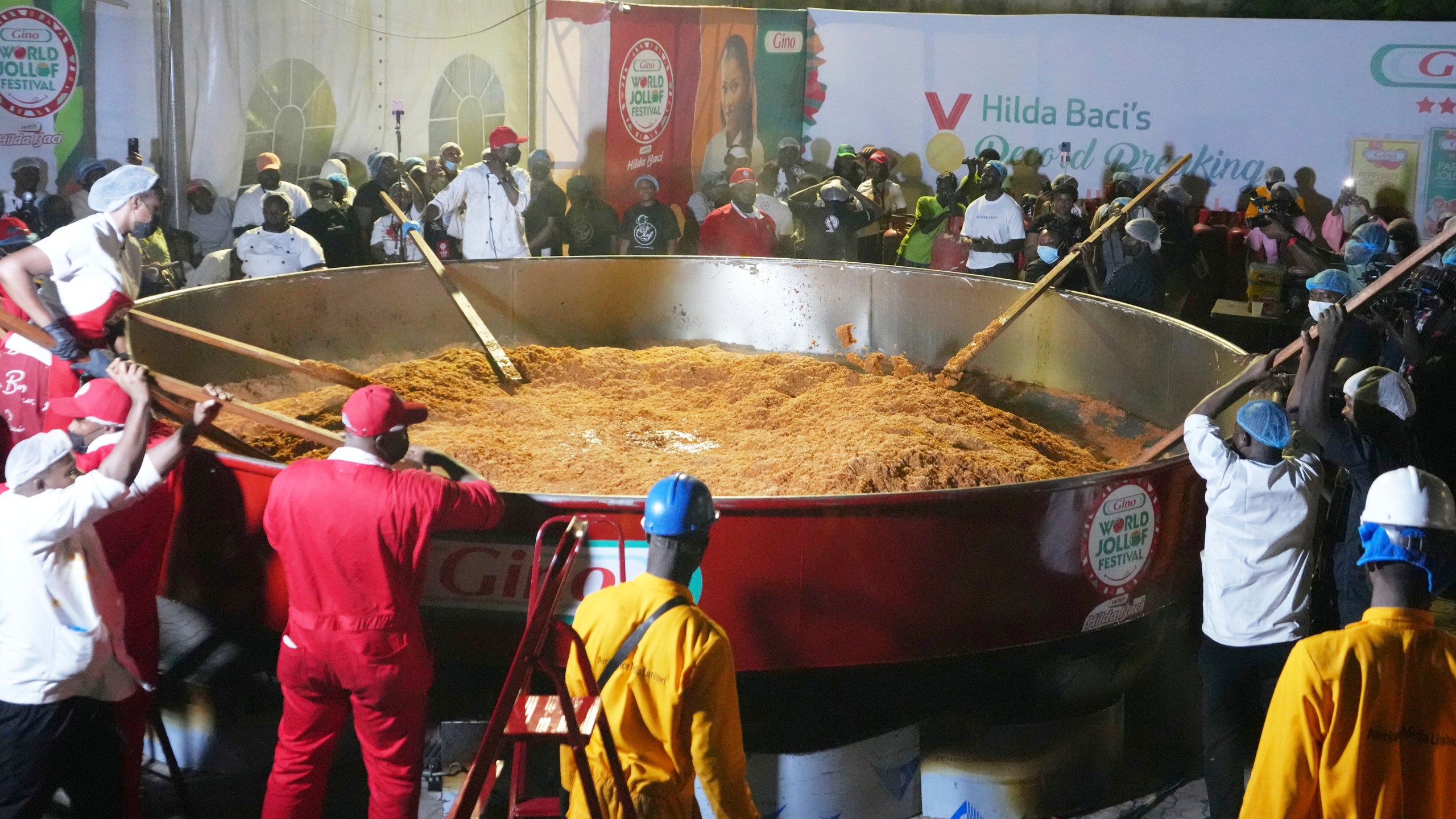 Chef Hilda Baci and her team attempt to cook the world's largest pot of Jollof Rice in Lagos, Nigeria, Friday, Sept 12, 2025. (AP Photo/Sunday Alamba)