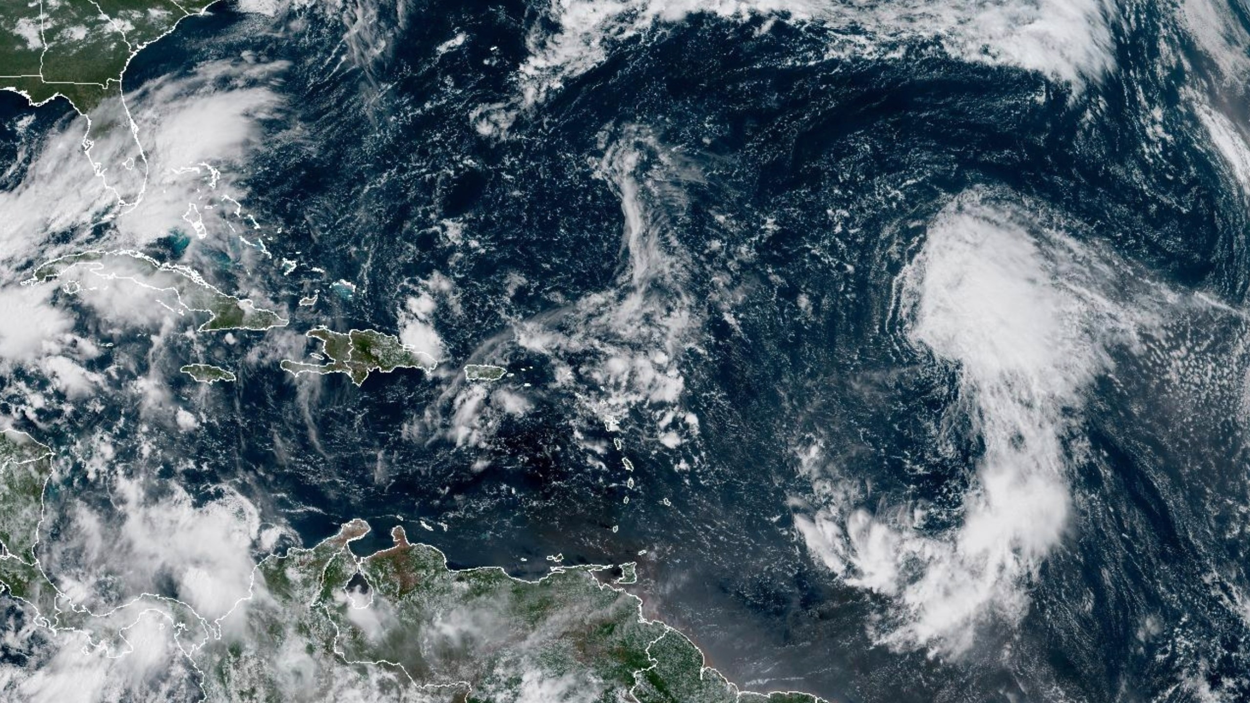 This GOES-19 GeoColor satellite image taken Wednesday, Sept. 17, 2025 at 10:50 a.m. EDT, and provided by NOAA, shows Tropical Storm Gabrielle, right, in the tropical Atlantic Ocean. (NOAA via AP)