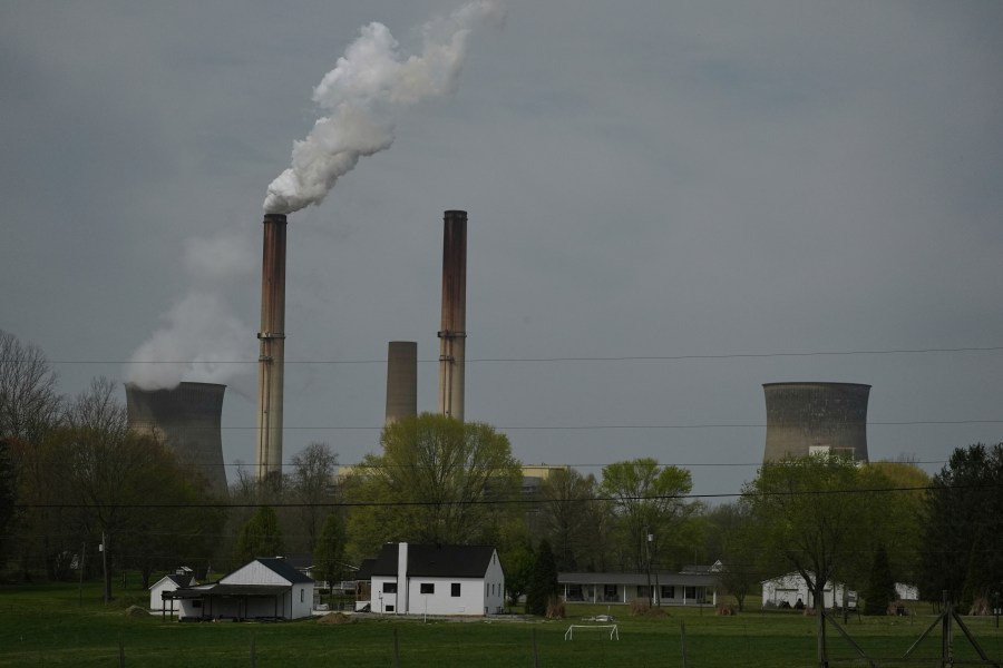 FILE - A home sits near the Gen. James Gavin Power Plant, a coal-fired power plant, April 14, 2025, in Point Pleasant, W.Va. (AP Photo/Joshua A. Bickel, File)