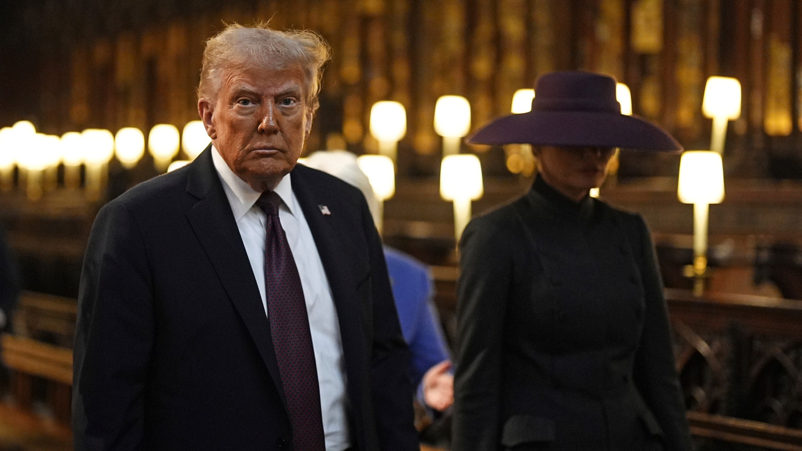 President Donald Trump and first lady Melania Trump attend their visit to St George's Chapel at Windsor Castle, in Windsor, England, Wednesday Sept. 17, 2025. (Aaron Chown/Pool Photo via AP)