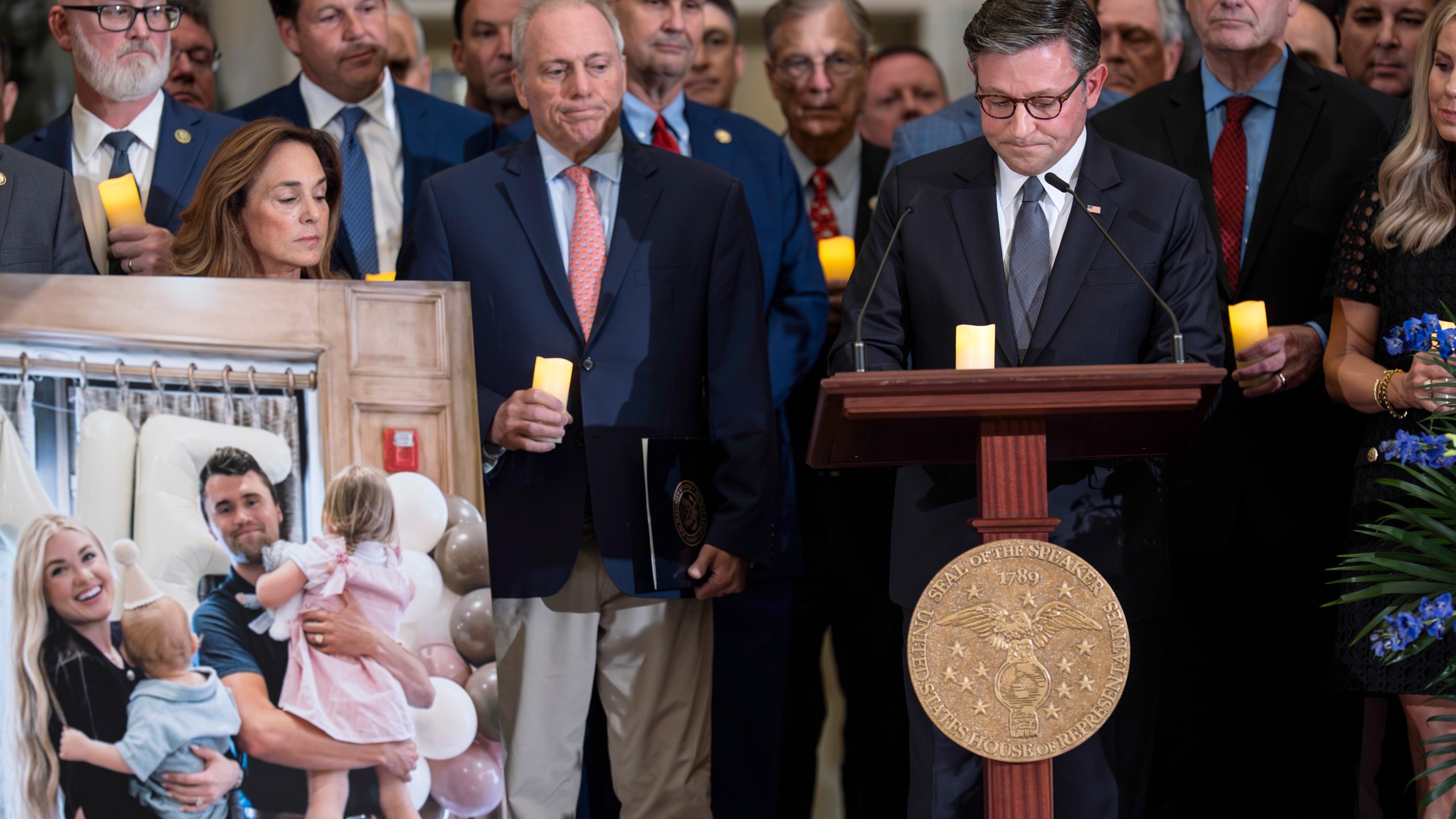 Speaker of the House Mike Johnson, R-La., right, joined by Majority Leader Steve Scalise, R-La., center left, leads a vigil to honor conservative activist Charlie Kirk who was shot and killed at an event in Utah last week, at the Capitol in Washington, Monday, Sept. 15, 2025. (AP Photo/J. Scott Applewhite)