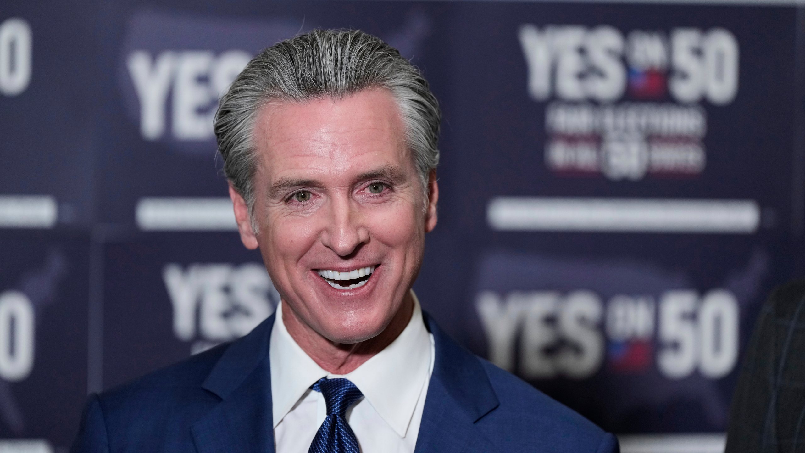 California Gov. Gavin Newsom answers questions after signing legislation calling for a special election on a redrawn congressional map on Thursday, Aug. 21, 2025, in Sacramento, Calif. (AP Photo/Godofredo A. Vásquez)