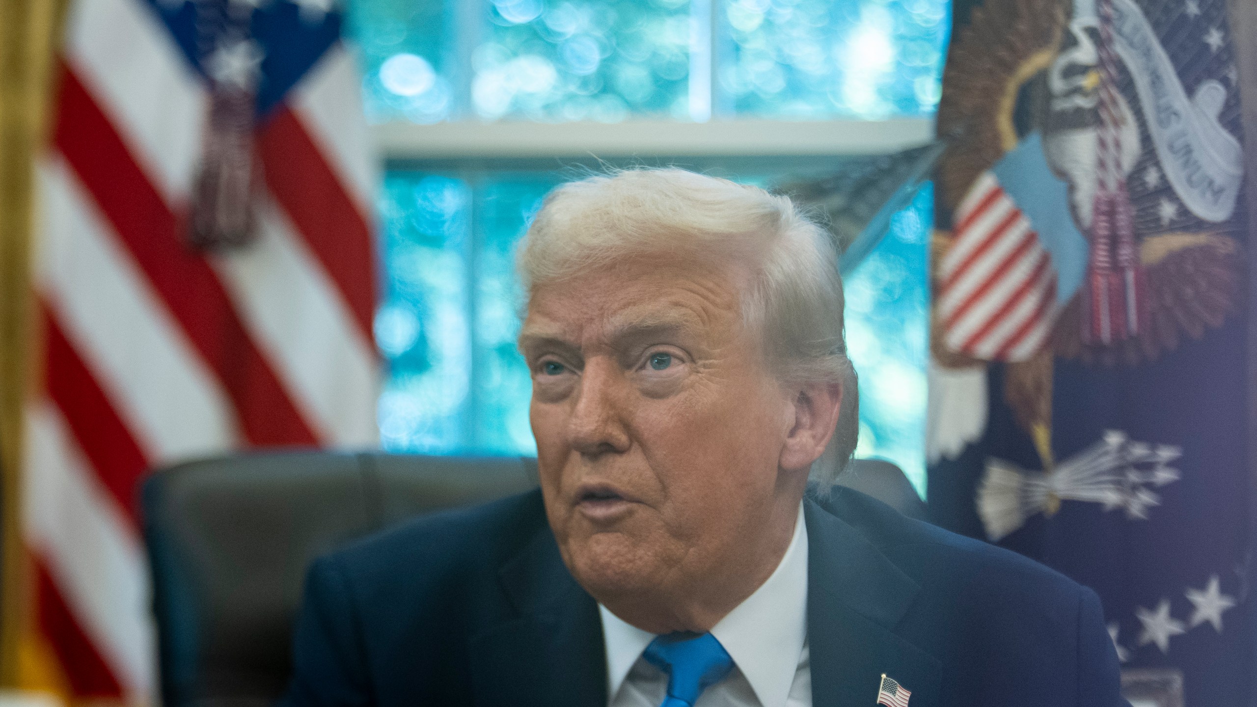 President Donald Trump speaks with reporters in the Oval Office of the White House, Friday, Sept. 19, 2025, in Washington. (AP Photo/Alex Brandon)