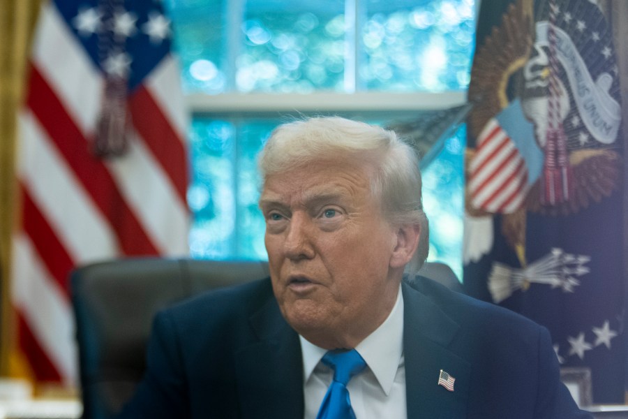President Donald Trump speaks with reporters in the Oval Office of the White House, Friday, Sept. 19, 2025, in Washington. (AP Photo/Alex Brandon)