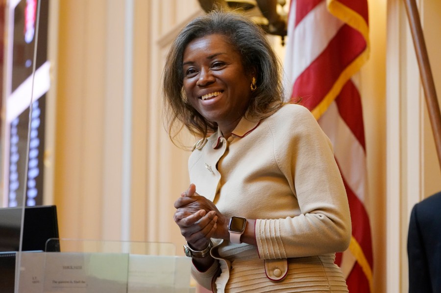 FILE - Virginia Lt. Gov. Winsome Earle-Sears greets visitors prior to the start of the Senate Session at the Virginia Capitol, Jan. 25, 2022, in Richmond, Va. (AP Photo/Steve Helber, File)