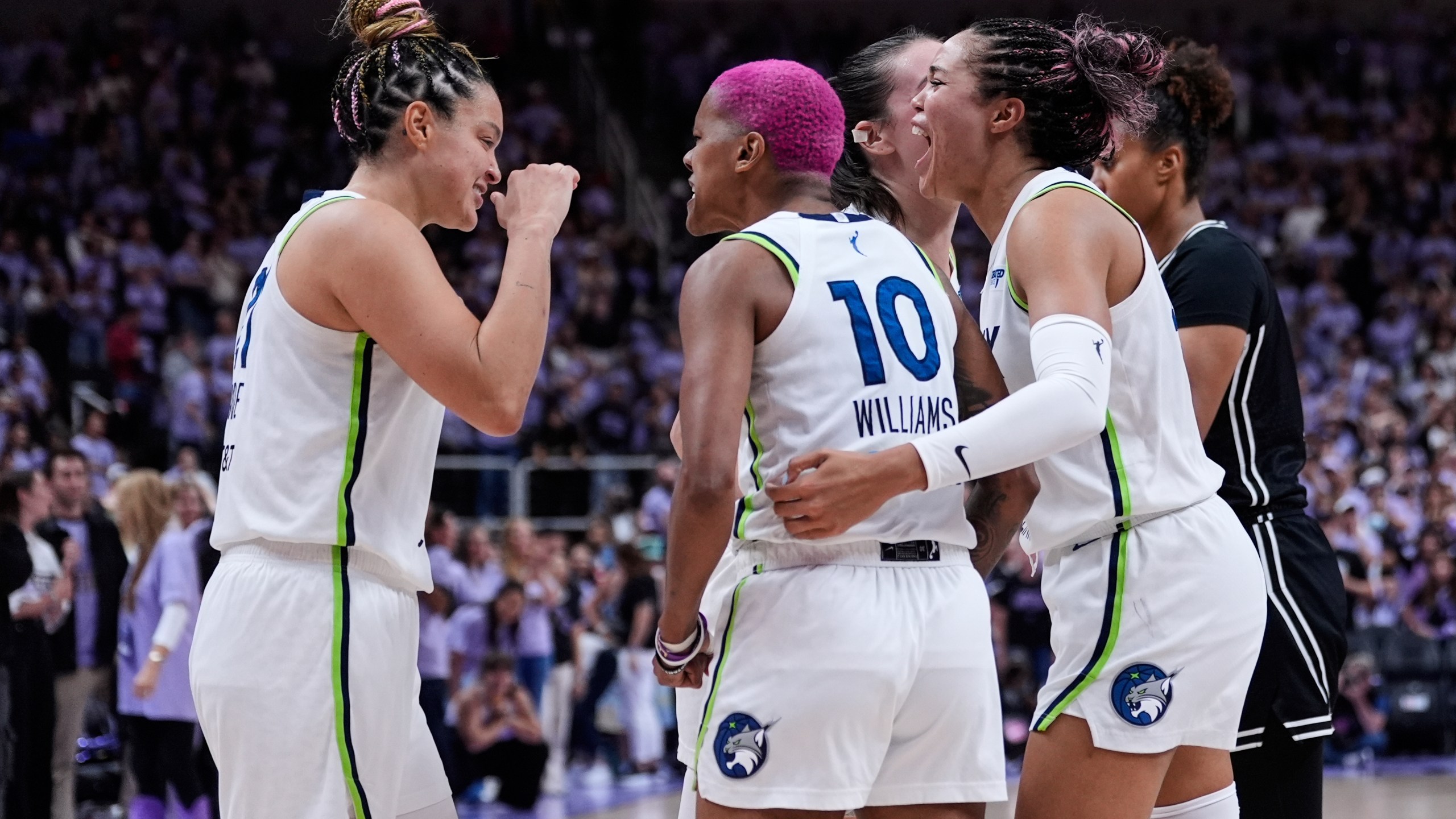 From left, Minnesota Lynx's Kayla McBride, Courtney Williams and Napheesa Collier celebrate after the team's victory over the Golden State Valkyries in the first round of the WNBA basketball playoffs Wednesday, Sept. 17, 2025, in San Jose, Calif. (AP Photo/Godofredo A. Vásquez)
