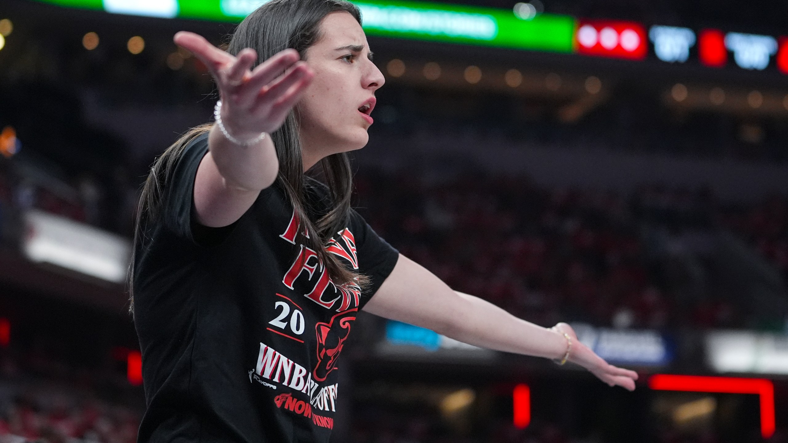 Indiana Fever guard Caitlin Clark (22) gestures on the bench in the first half of a WNBA basketball playoff game between the Indiana Fever and the Atlanta Dream in Indianapolis, Tuesday, Sept. 16, 2025. (AP Photo/Michael Conroy)