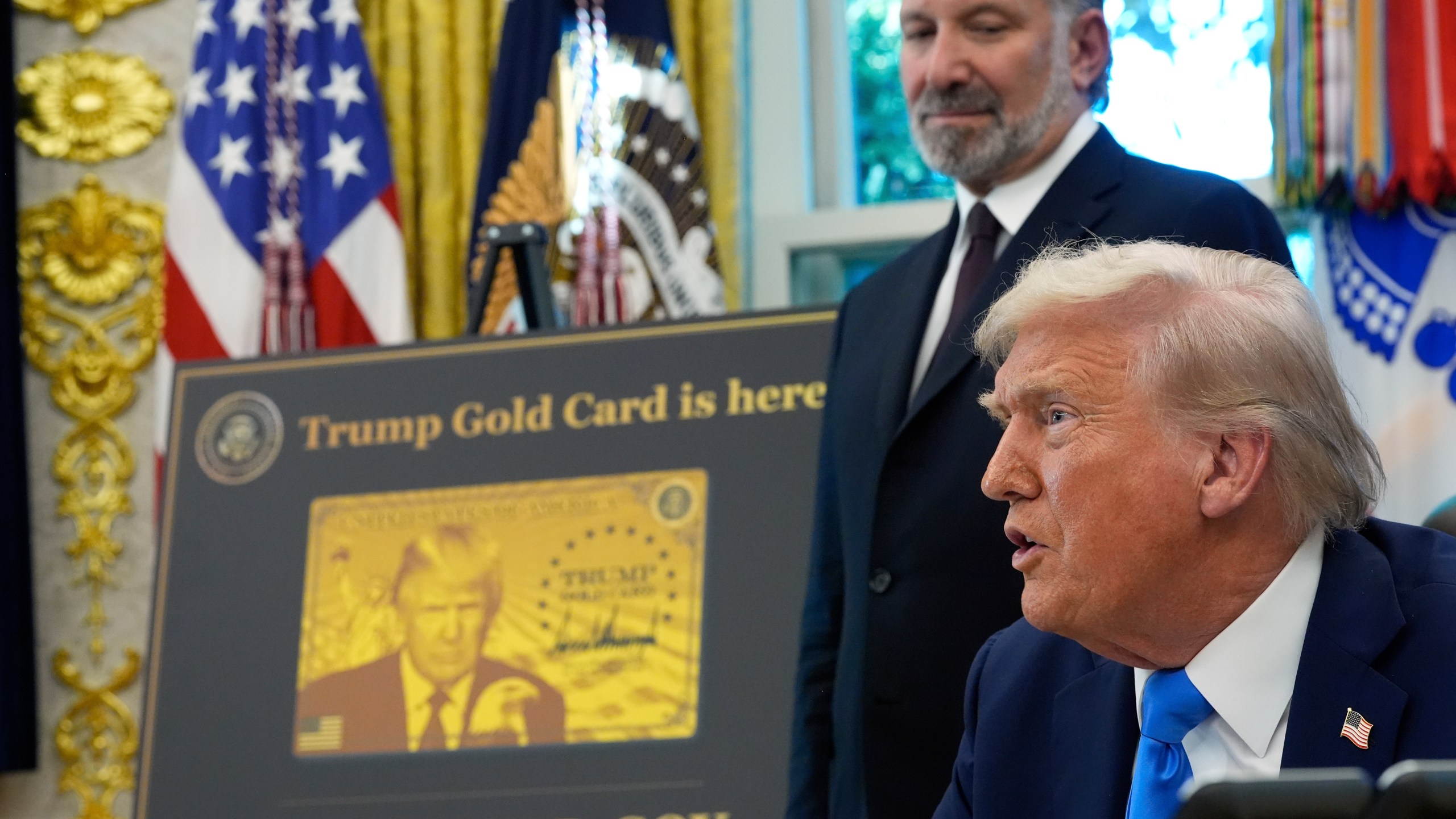 President Donald Trump speaks as Commerce Secretary Howard Lutnick listens in the Oval Office of the White House, Friday, Sept. 19, 2025, in Washington. (AP Photo/Alex Brandon)