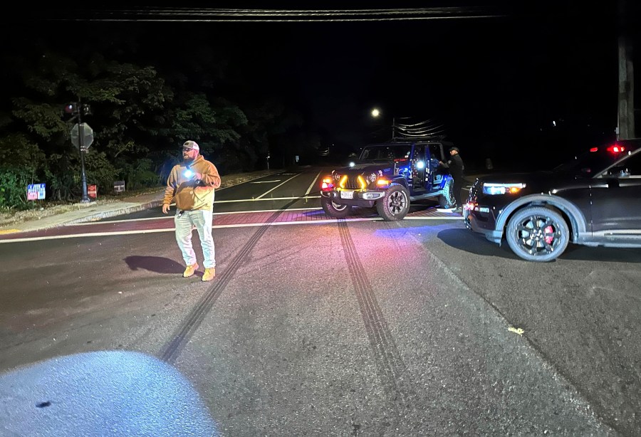 Police block a road to a country club where a shooting happened at Sky Meadow Country Club in Nashua, New Hampshire, Saturday, Sept. 20, 2025. (AP Photo/Michael Casey)