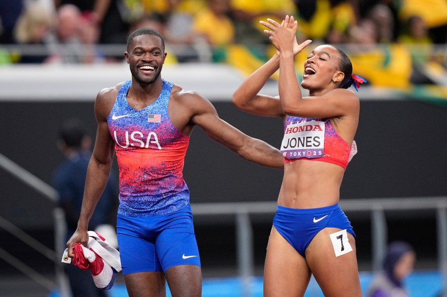 Gold medalist United States' Rai Benjamin of the men's 400 meters hurdles final celebrates with silver medalist United States' Jasmine Jones of women's 400 meters hurdles final at the World Athletics Championships in Tokyo, Friday, Sept. 19, 2025. (AP Photo/Eugene Hoshiko)