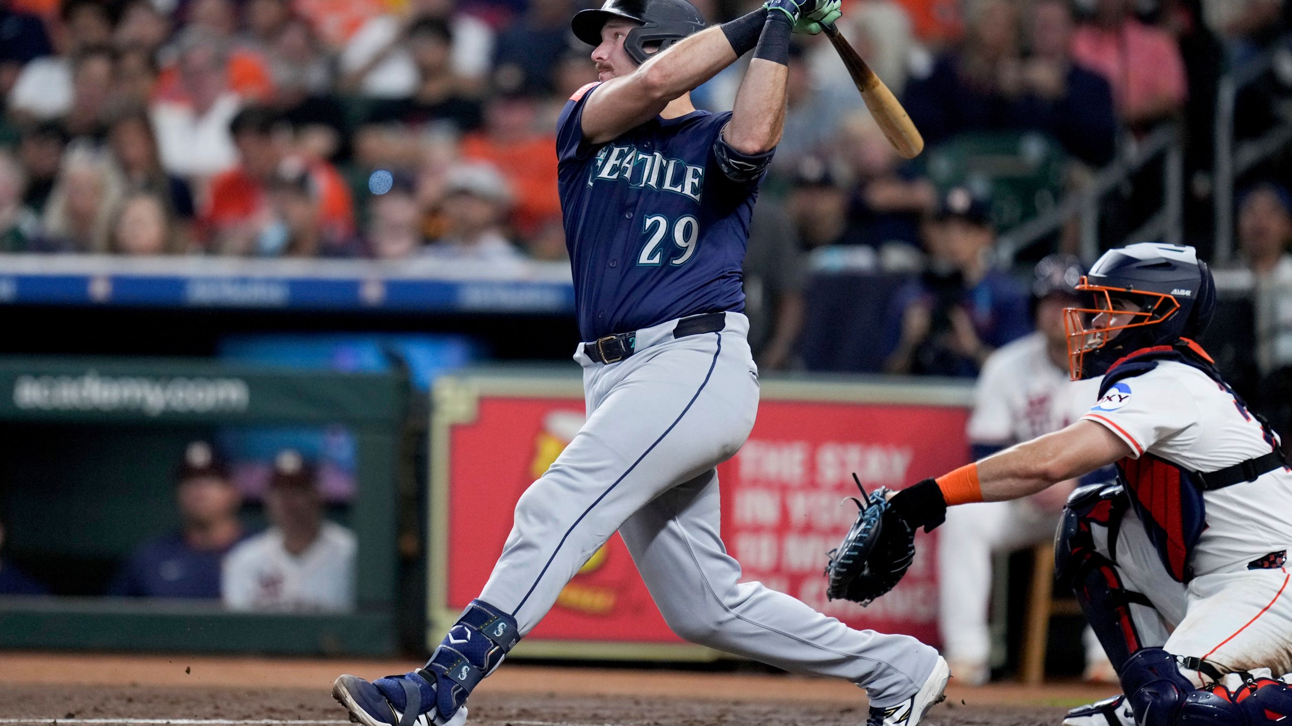 Seattle Mariners' Cal Raleigh (29) hits a solo home run, his 57th of the season, against the Houston Astros during the third inning of a baseball game Saturday, Sept. 20, 2025, in Houston. (AP Photo/Eric Christian Smith)
