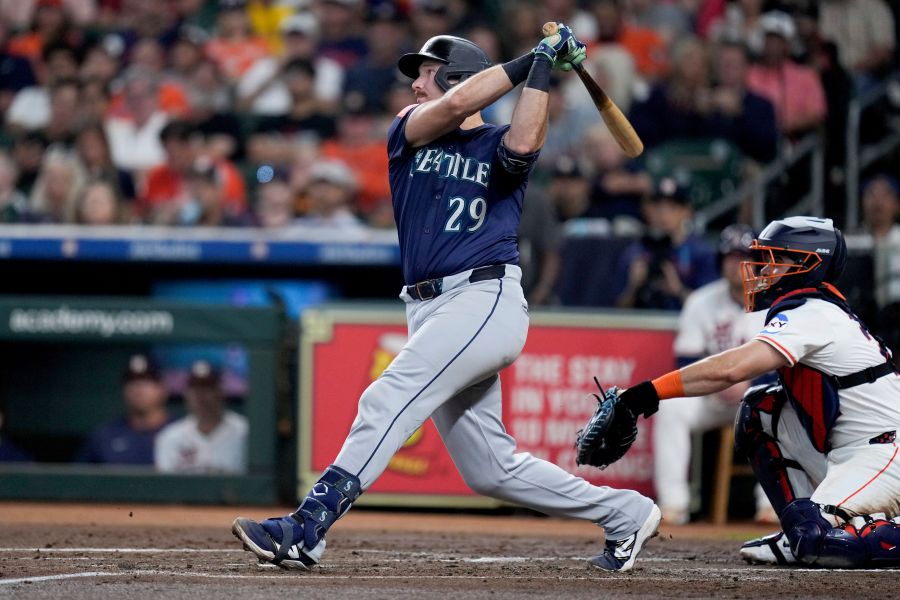 Seattle Mariners' Cal Raleigh (29) hits a solo home run, his 57th of the season, against the Houston Astros during the third inning of a baseball game Saturday, Sept. 20, 2025, in Houston. (AP Photo/Eric Christian Smith)