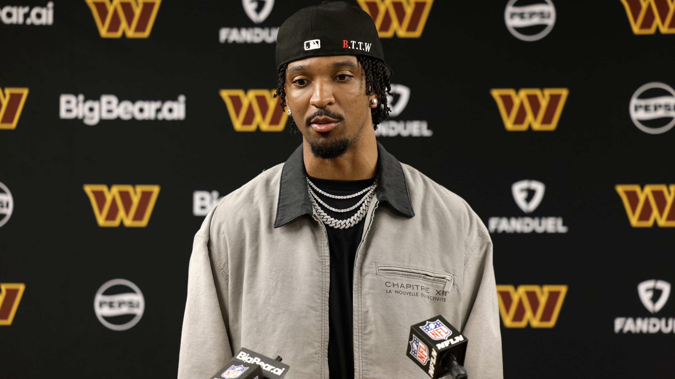 Washington Commanders quarterback Jayden Daniels speaks during a news conference following an NFL football game against the Green Bay Packers Thursday, Sept. 11, 2025, in Green Bay, Wis. (AP Photo/Matt Ludtke)