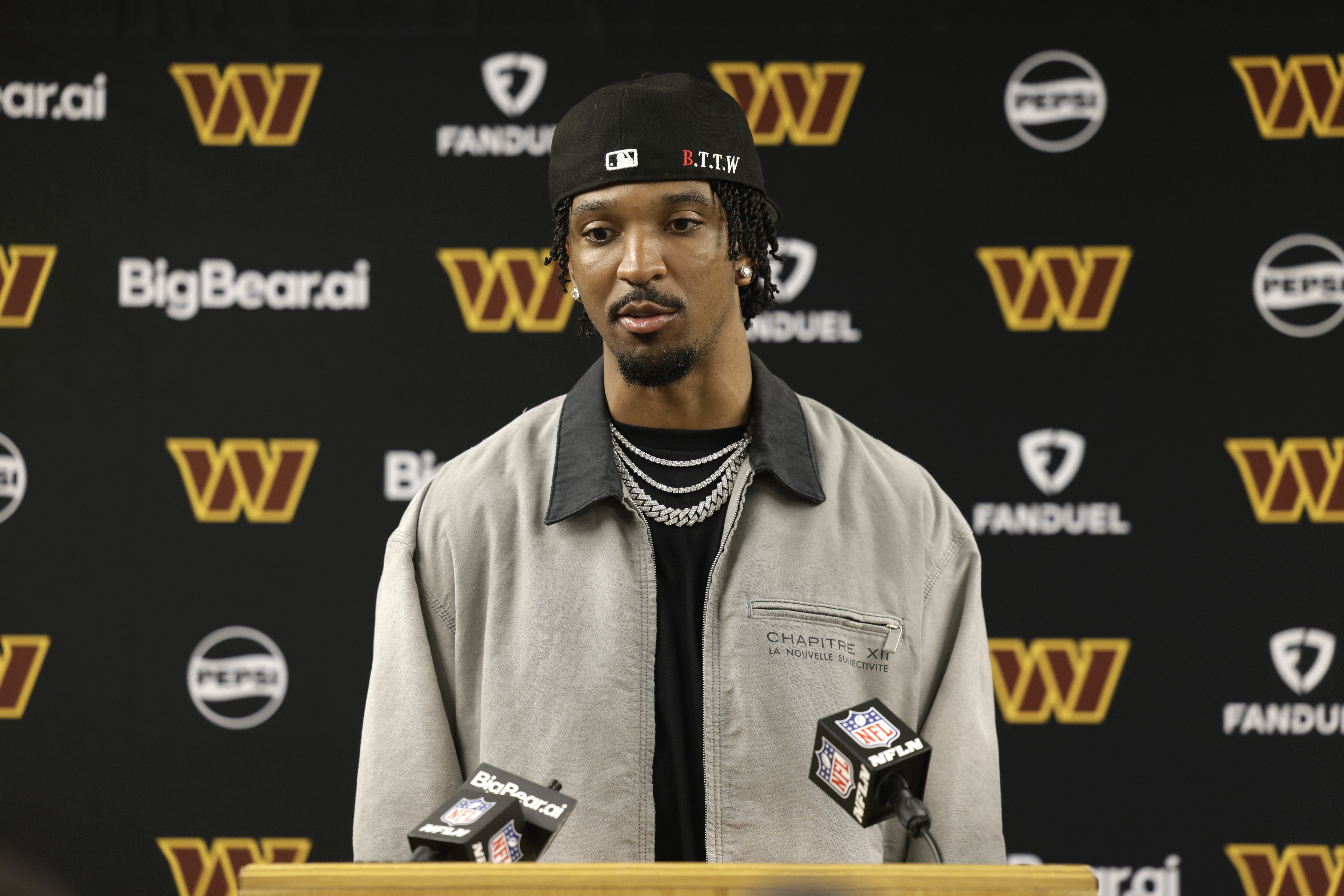 Washington Commanders quarterback Jayden Daniels speaks during a news conference following an NFL football game against the Green Bay Packers Thursday, Sept. 11, 2025, in Green Bay, Wis. (AP Photo/Matt Ludtke)