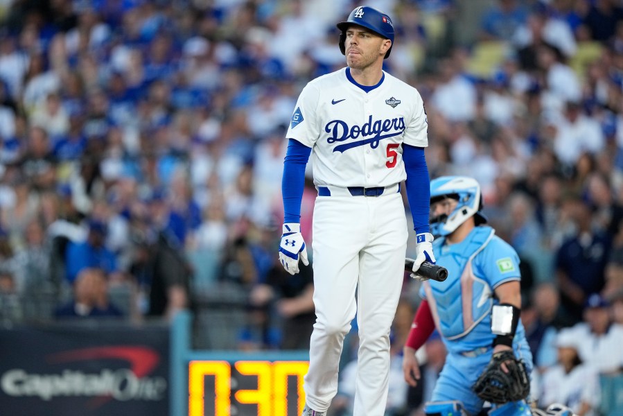Los Angeles Dodgers' Freddie Freeman walks to the dugout after striking out against the Toronto Blue Jays during the second inning in Game 5 of baseball's World Series, Wednesday, Oct. 29, 2025, in Los Angeles. (AP Photo/Brynn Anderson)