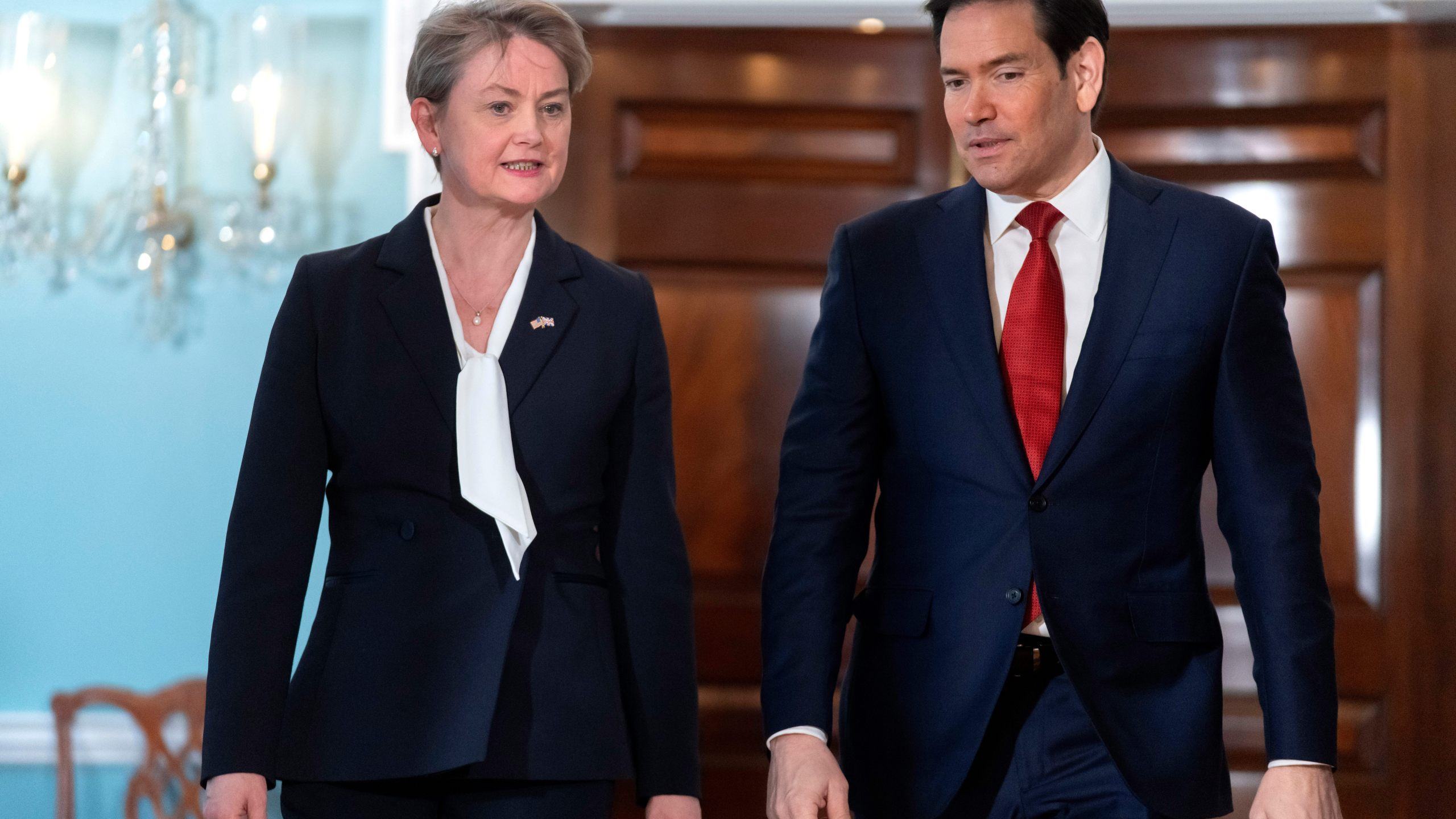 Secretary of State Marco Rubio, right, walks with Britain's Foreign Secretary Yvette Cooper at the State Department, Monday, Dec. 8, 2025, in Washington. (AP Photo/Mark Schiefelbein)