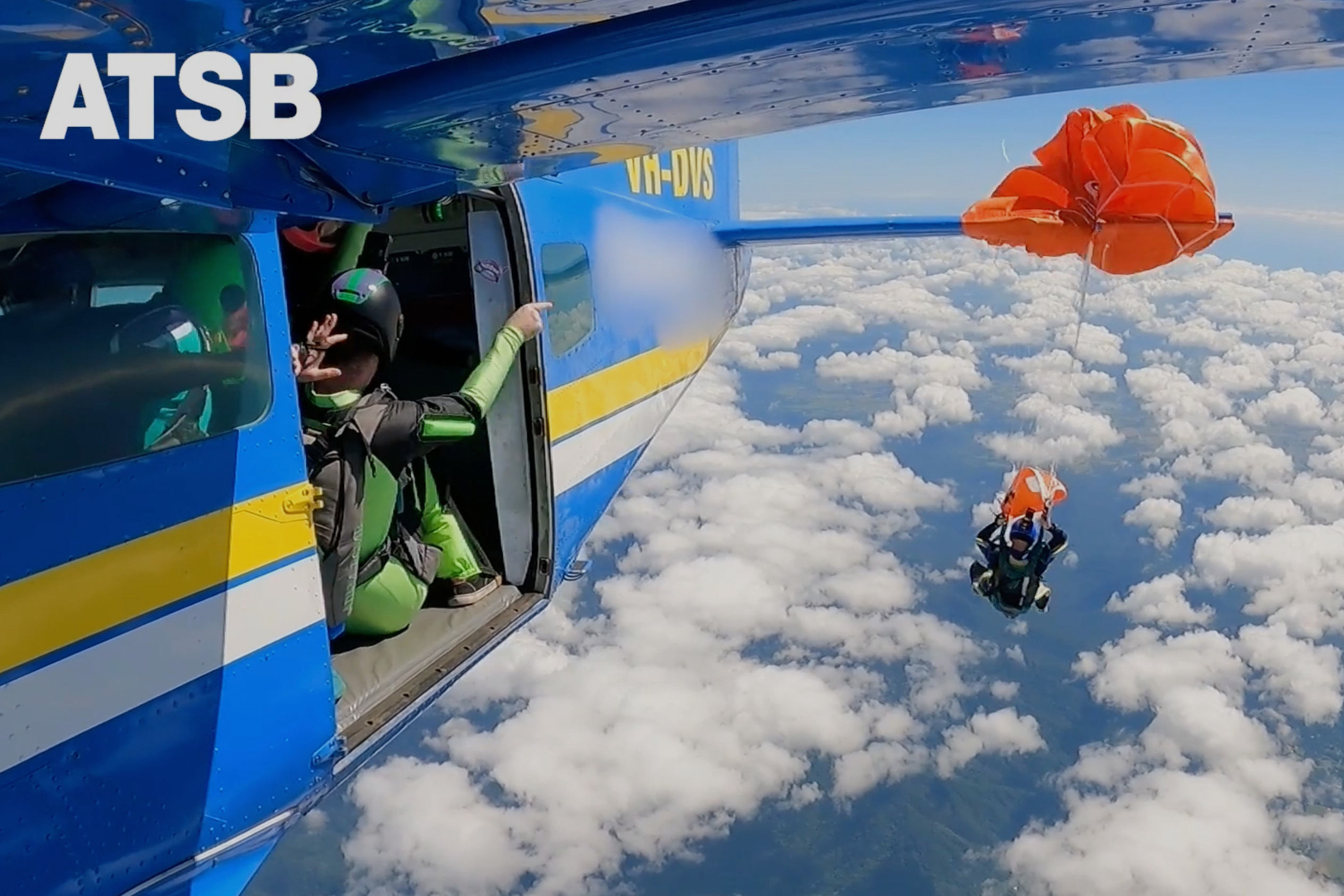 In this image taken from a video a skydiver is caught on the wing of a plane as he exited the aircraft in Tully, North Queensland, Sept.20, 2025.(Jarrad Nolan/Australian Transport Safety Bureau via AP)