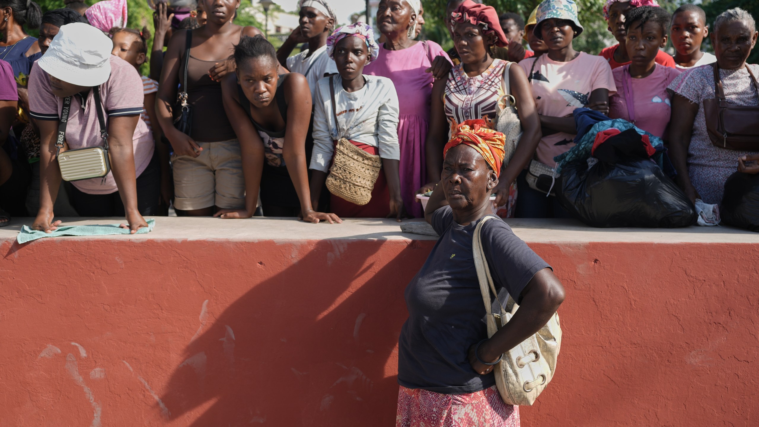 Residents attend the funeral of people killed in a landslide triggered by Hurricane Melissa in Petit-Goave, Haiti, Saturday, Nov. 15, 2025. (AP Photo/Odelyn Joseph).