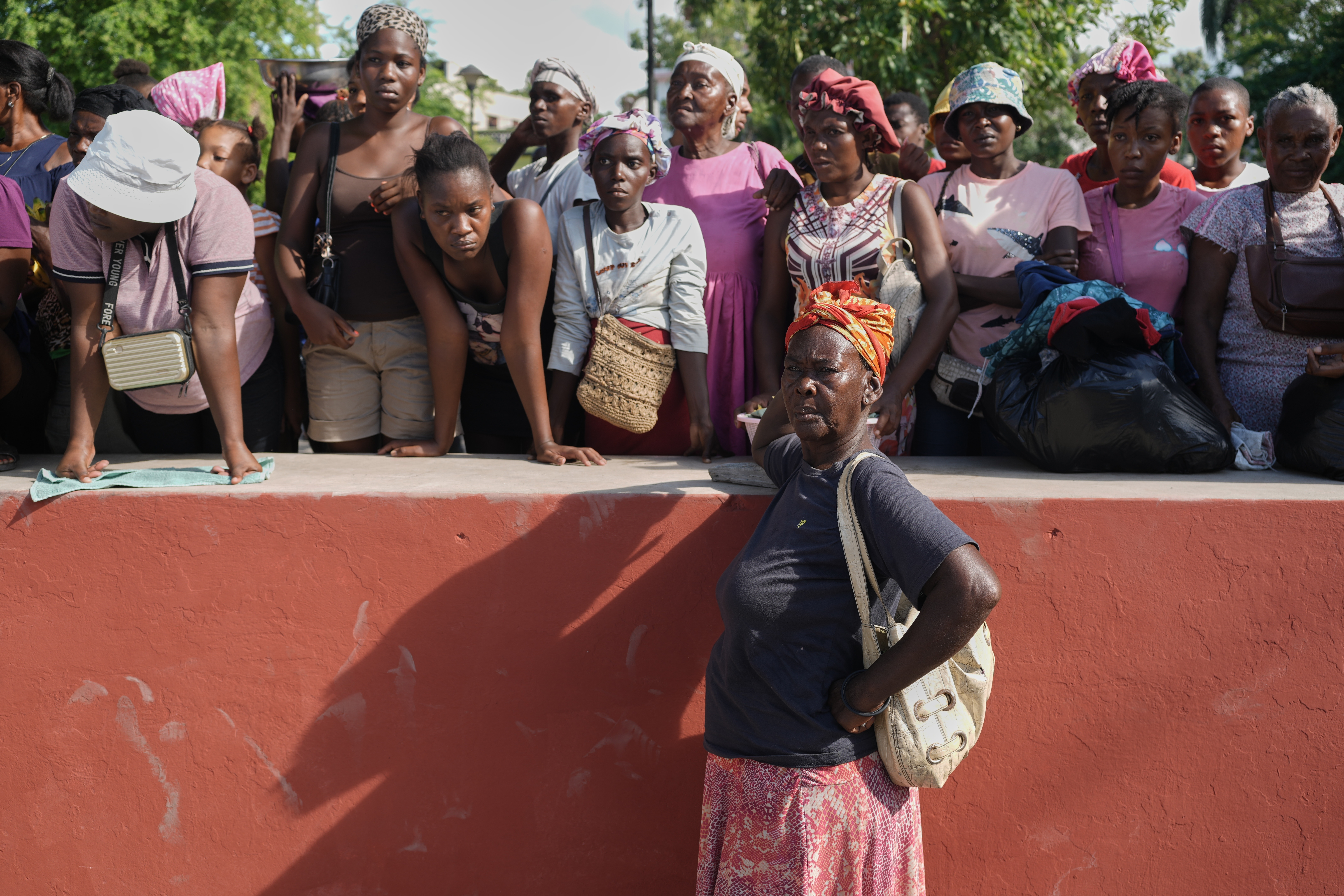 Residents attend the funeral of people killed in a landslide triggered by Hurricane Melissa in Petit-Goave, Haiti, Saturday, Nov. 15, 2025. (AP Photo/Odelyn Joseph).