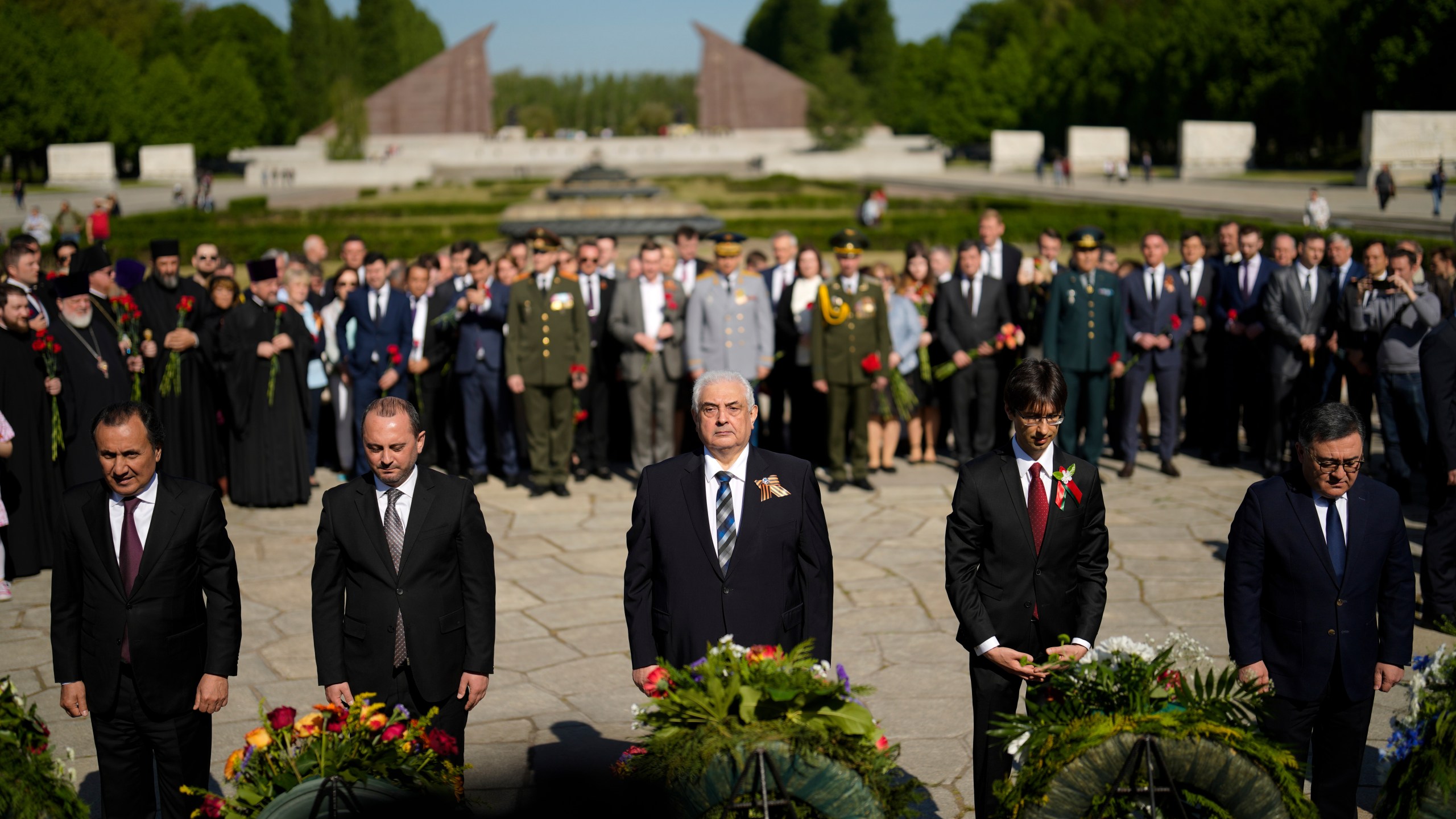 FILE — Russian ambassador in Germany Sergey Nechayev, center, attends a wreath laying ceremony to commemorate the end of World War II 77 years ago at the Soviet War Memorial at the district Treptow in Berlin, Germany, May 9, 2022. (AP Photo/Markus Schreiber, File)