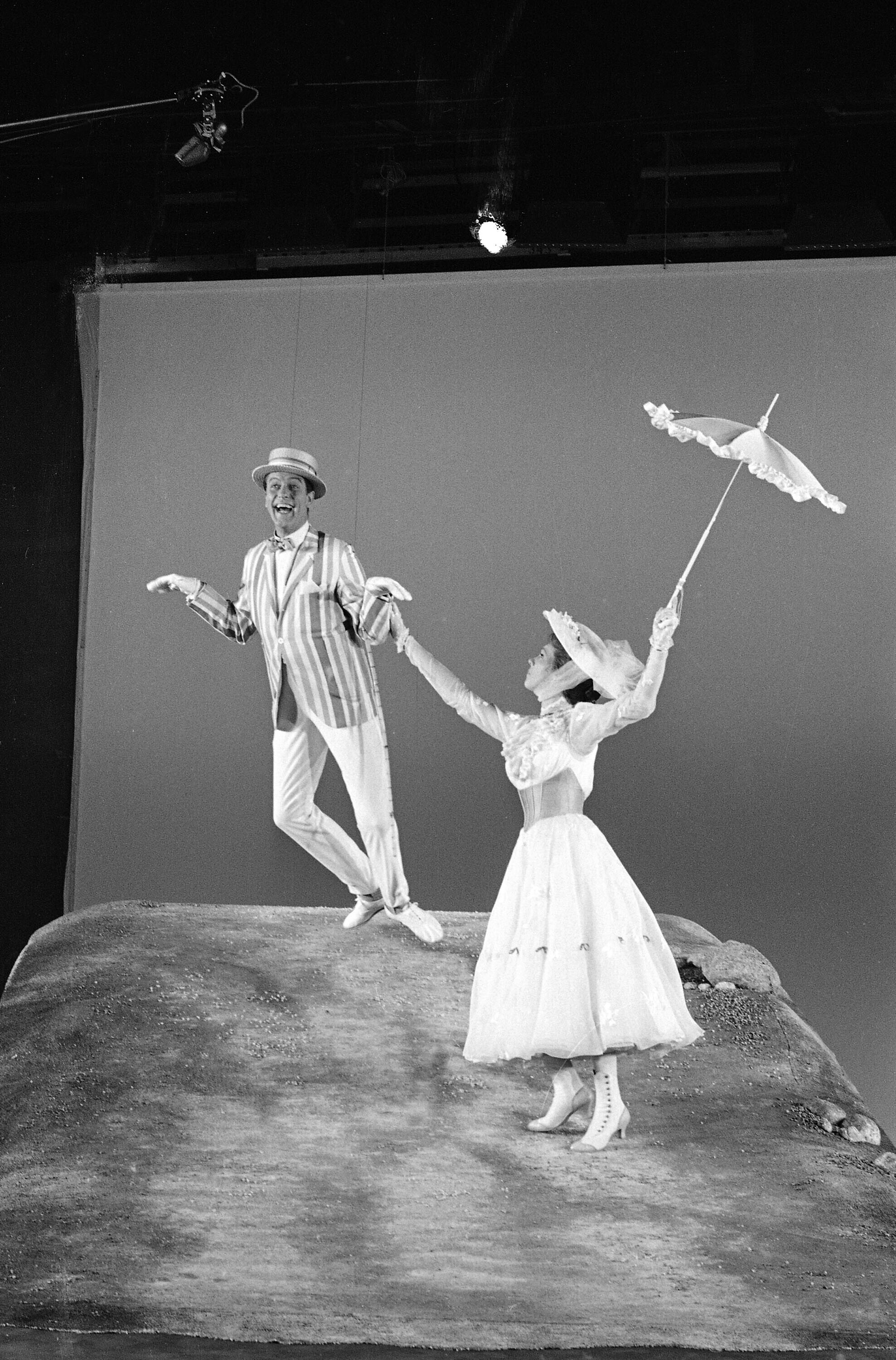 FILE - Dick Van Dyke and Julie Andrews dancing in a scene from the Disney movie " Mary Poppins" in Hollywood, Calif. June 25, 1963. (AP Photo/Don Brinn, File)