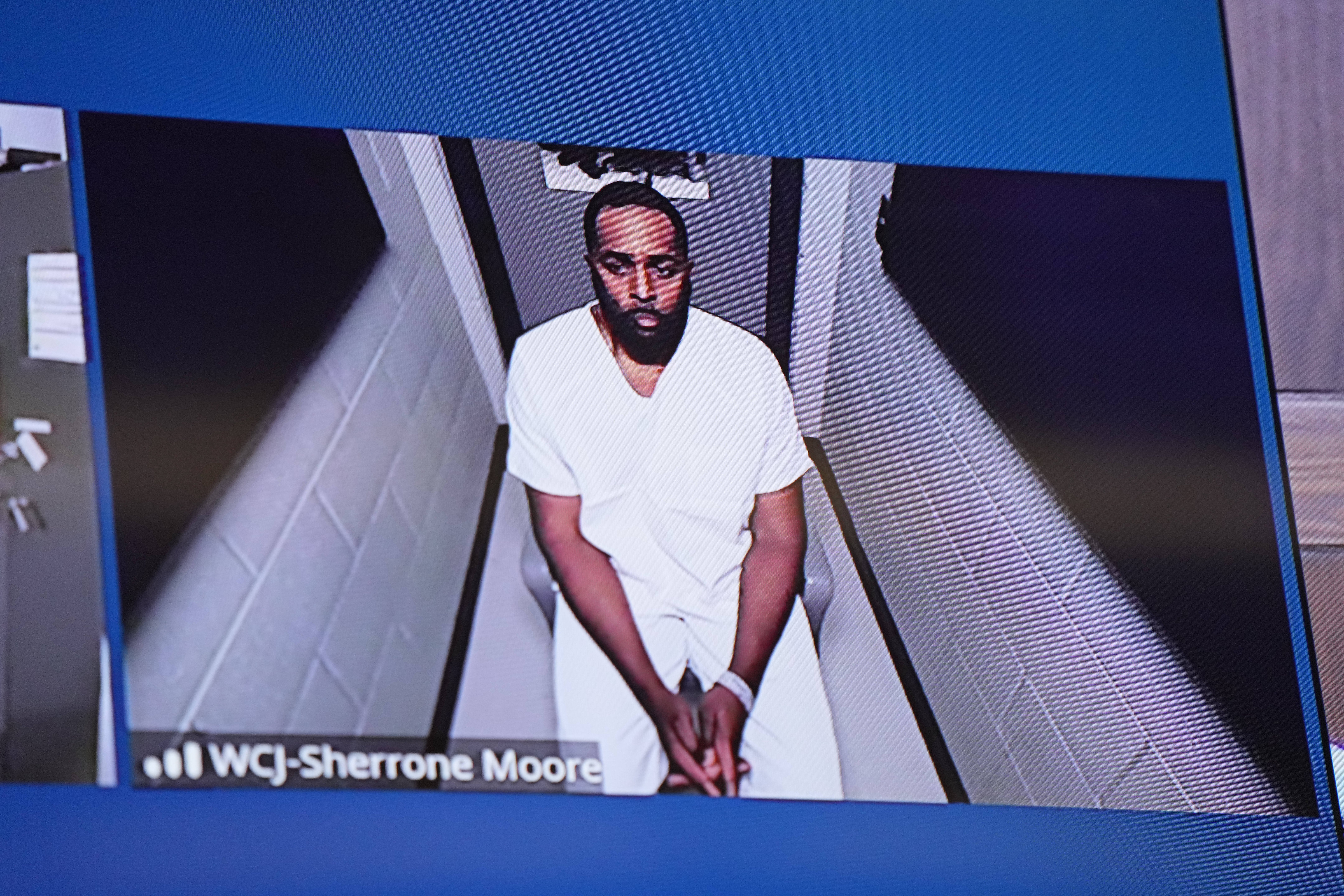 Fired Michigan football coach Sherrone Moore appears via video in court on Friday, Dec. 12, 2025 in Ann Arbor, Mich. (AP Photo/ Ryan Sun, Pool)
