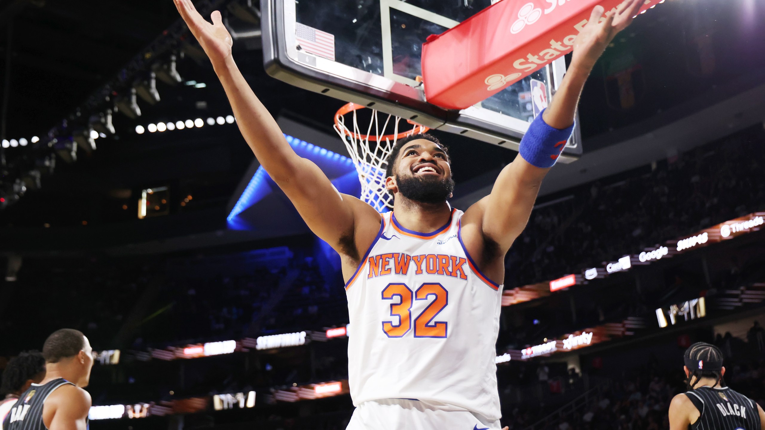 New York Knicks' center Karl-Anthony Towns (32) reacts to a call during the first half of an NBA Cup semifinals basketball game against Orlando Magic, Saturday, Dec. 13, 2025, in Las Vegas. (AP Photo/Ronda Churchill)