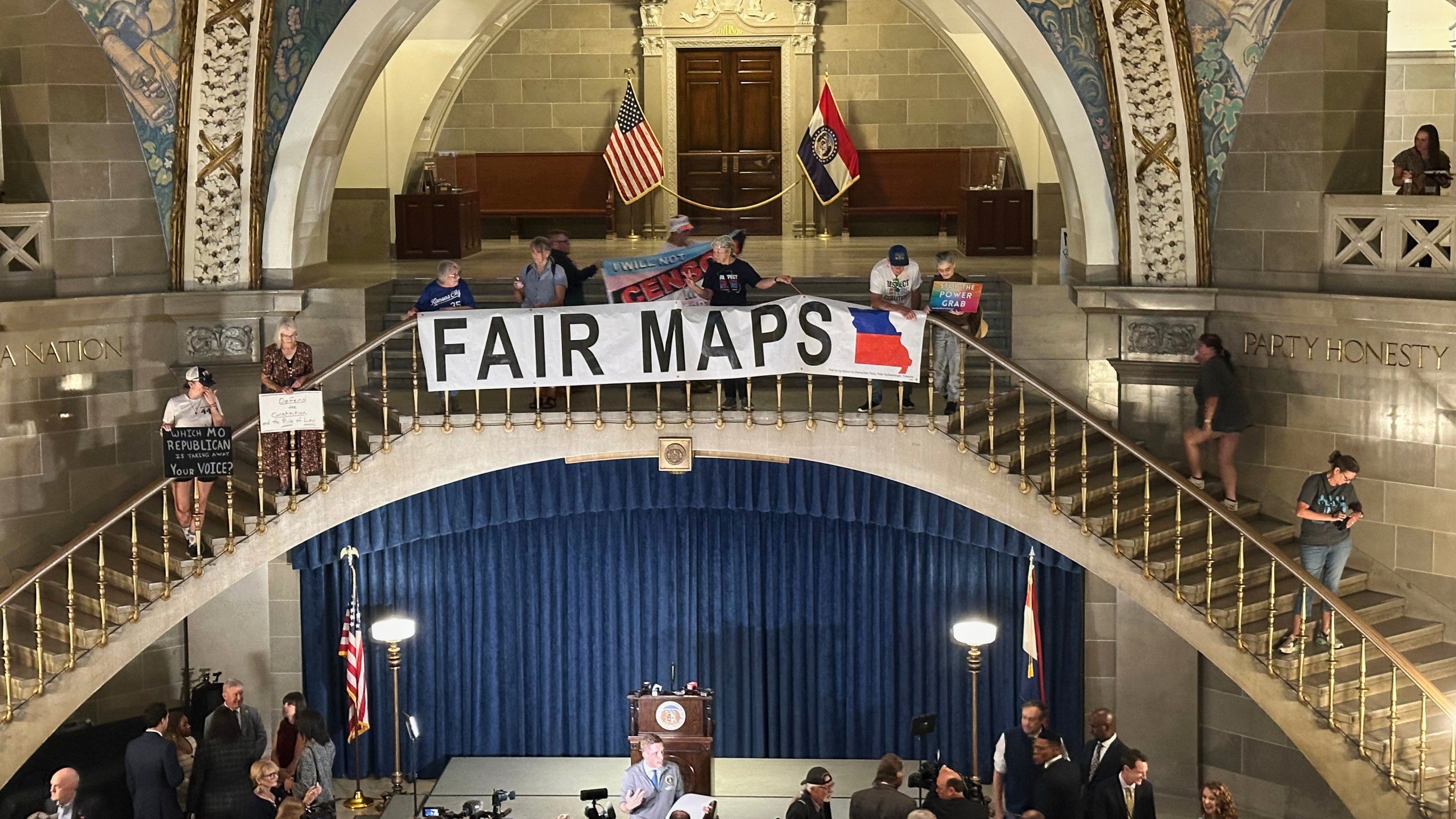 Opponents of Missouri's Republican-backed congressional redistricting plan display a banner in protest at the State Capitol in Jefferson City, Missouri, Sept. 10, 2025. (AP Photo/David A. Lieb)