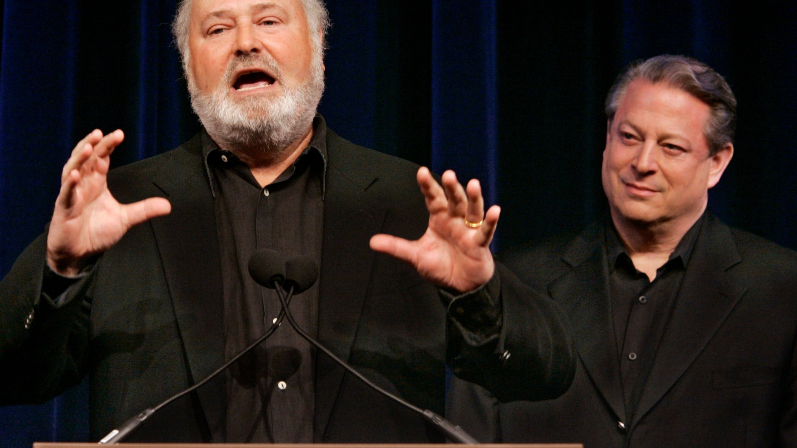 FILE - Former Vice President AL Gore, right, listens as movie director Rob Reiner addresses a Tribeca Film Festival news conference on a series of global warming-themed short films produced by the SOS (Save Our Selves) campaign which opened the festival in a gala hosted by Gore, April 25, 2007, in New York. (AP Photo/Richard Drew, File)