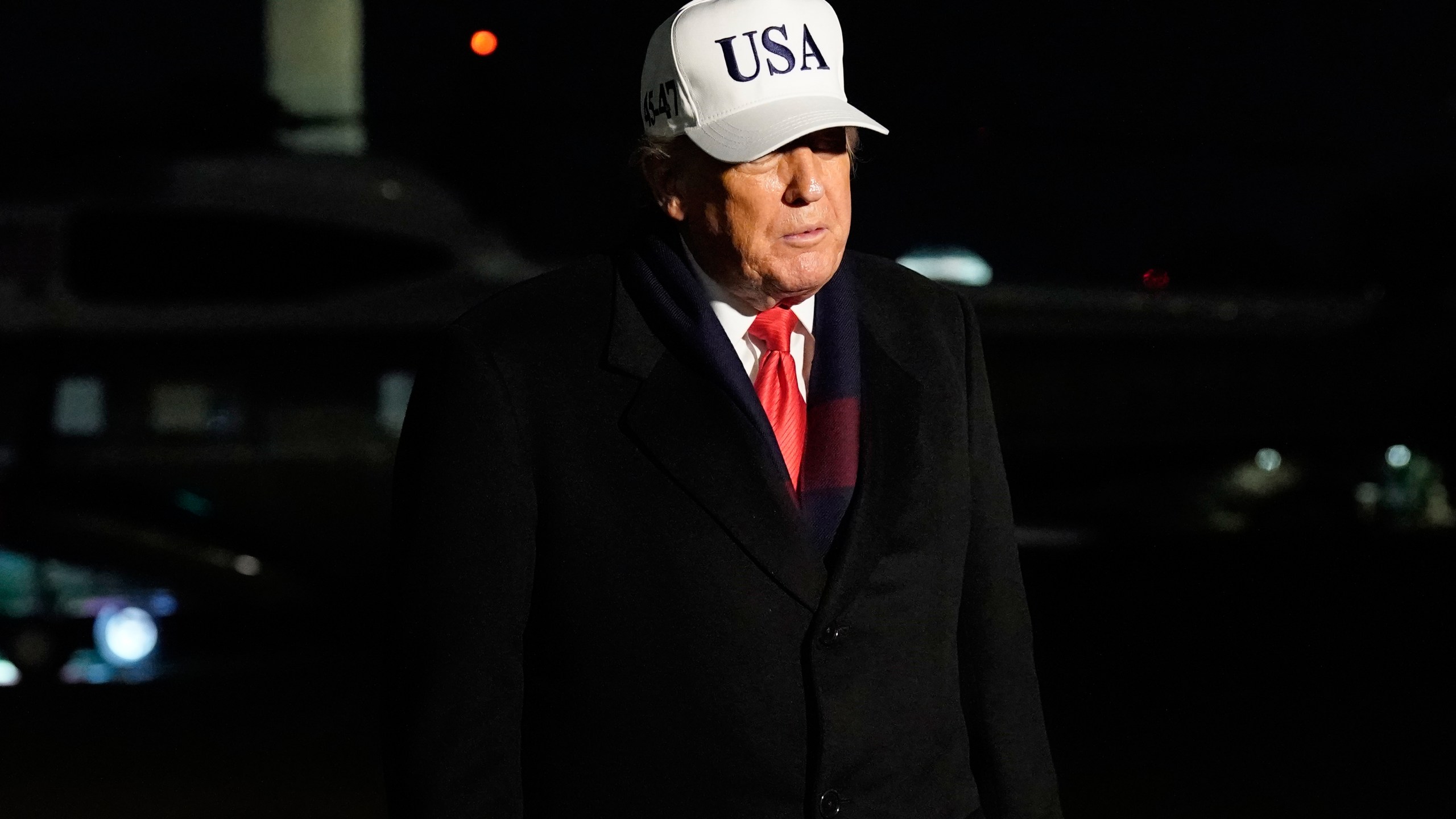 President Donald Trump talks to reporters as arrives on the South Lawn of the White House, Saturday, Dec. 13, 2025, after attending the Army-Navy game. (AP Photo/Jose Luis Magana)