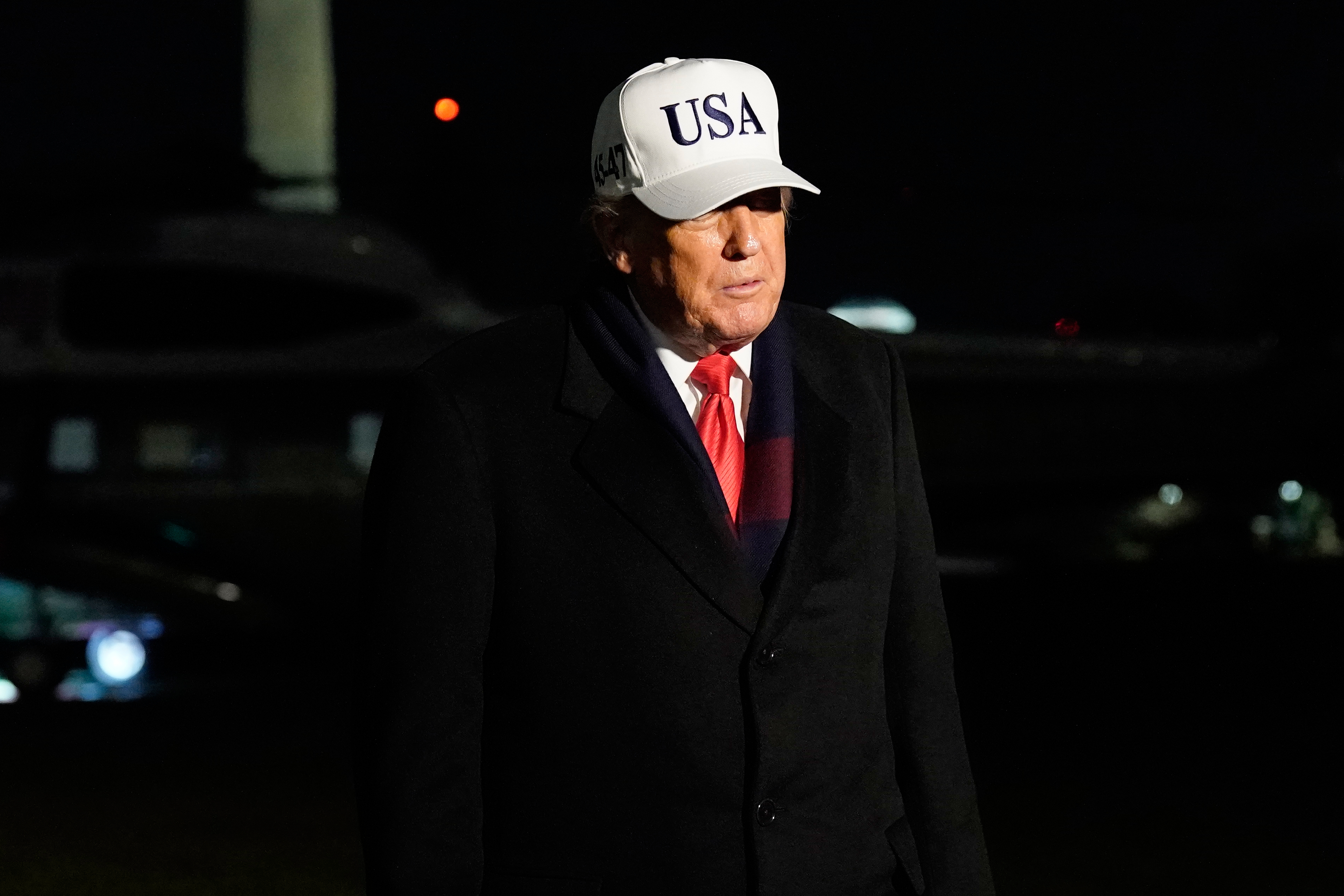 President Donald Trump talks to reporters as arrives on the South Lawn of the White House, Saturday, Dec. 13, 2025, after attending the Army-Navy game. (AP Photo/Jose Luis Magana)
