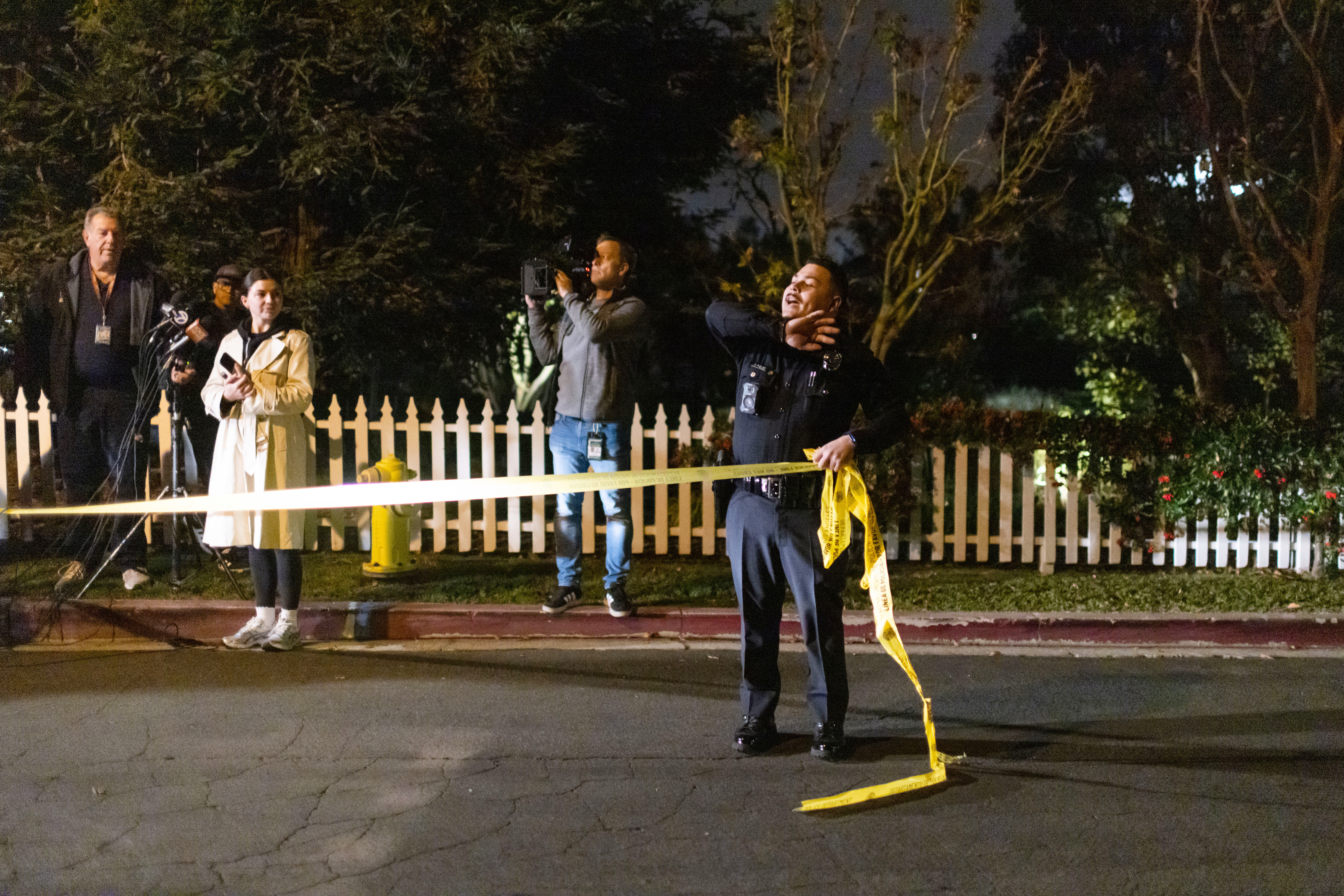 A police officer blocks off a street near Rob Reiner's residence Sunday, Dec. 14, 2025, in the Brentwood section of Los Angeles. (AP Photo/Ethan Swope)