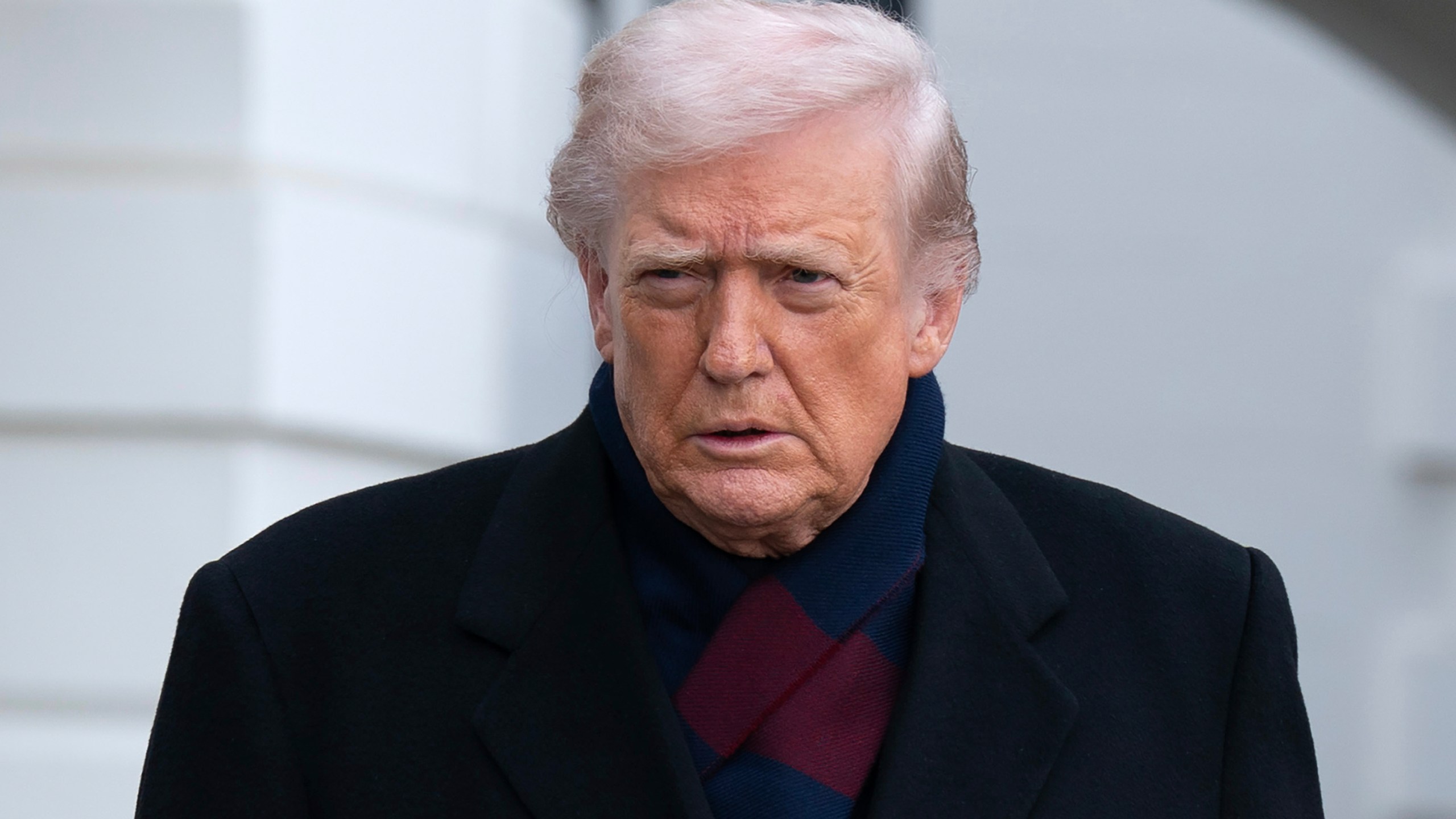 President Donald Trump talks to reporters as he departs from the South Lawn of the White House, Saturday, Dec. 13, 2025, in Washington, en route to Baltimore to attend the Army-Navy football game. (AP Photo/Jose Luis Magana)