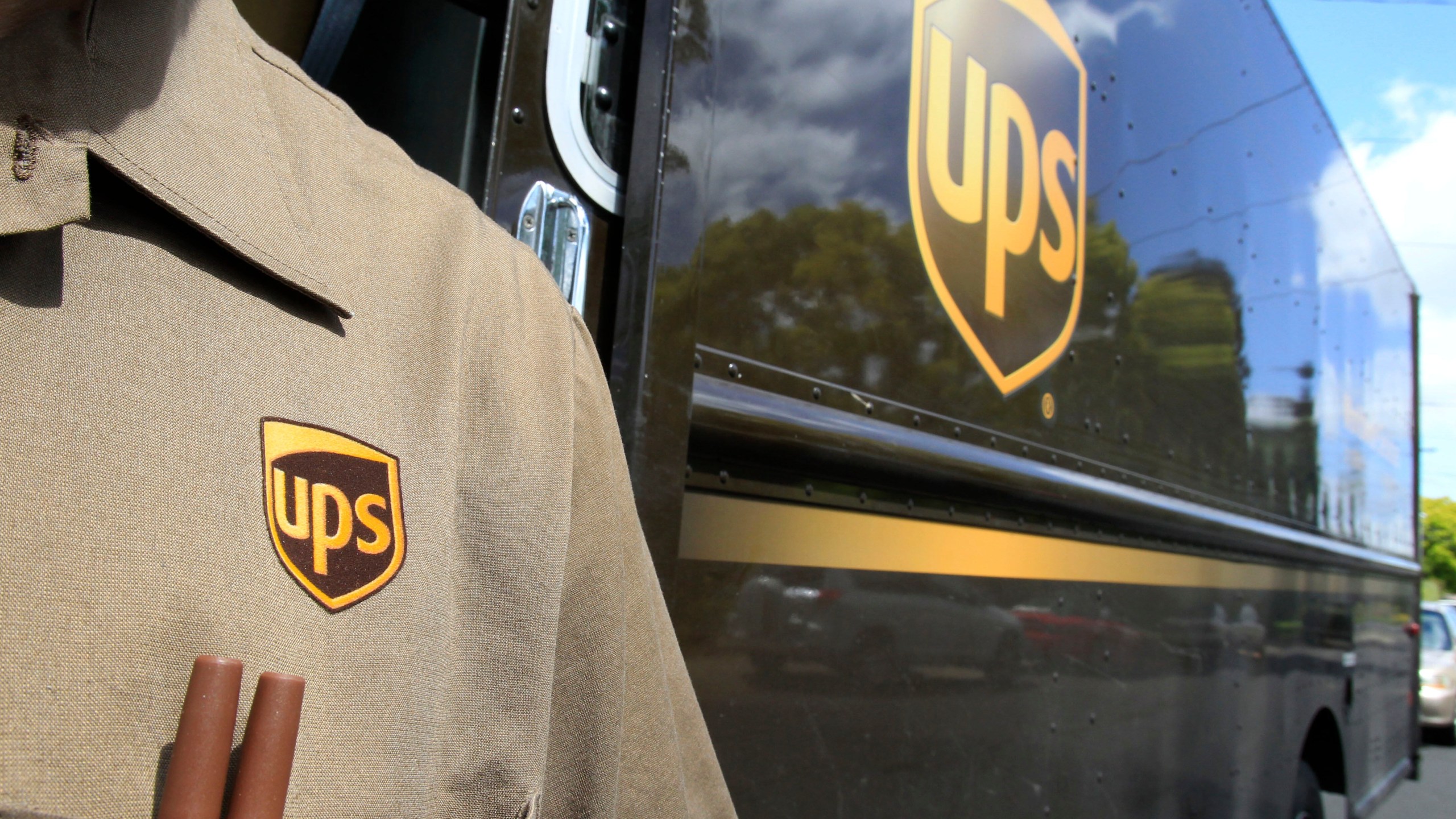 FILE - This April 25, 2011 file photo shows United Parcel Service driver Albert Palafox in Palo Alto, Calif. (AP Photo/Paul Sakuma, File)