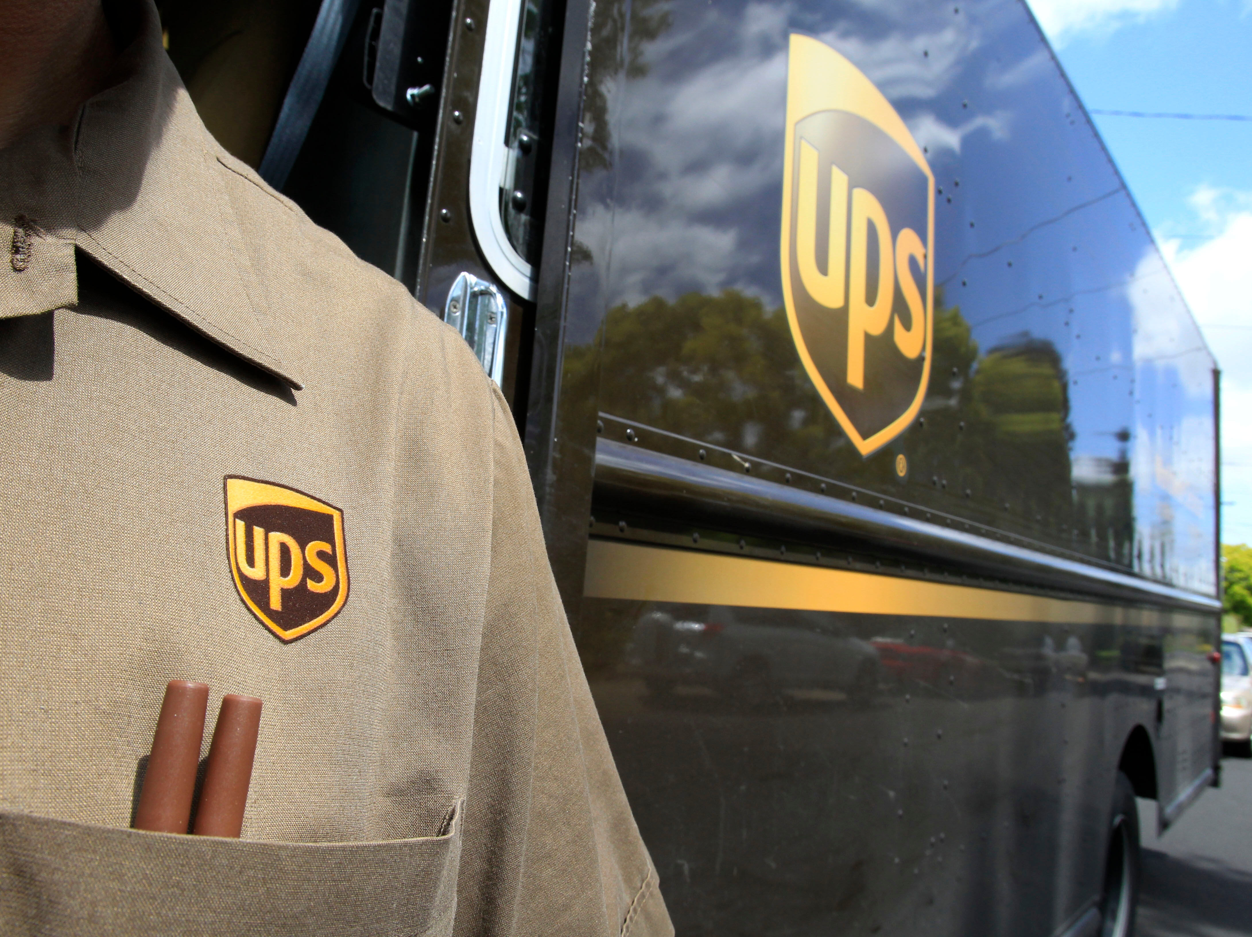 FILE - This April 25, 2011 file photo shows United Parcel Service driver Albert Palafox in Palo Alto, Calif. (AP Photo/Paul Sakuma, File)