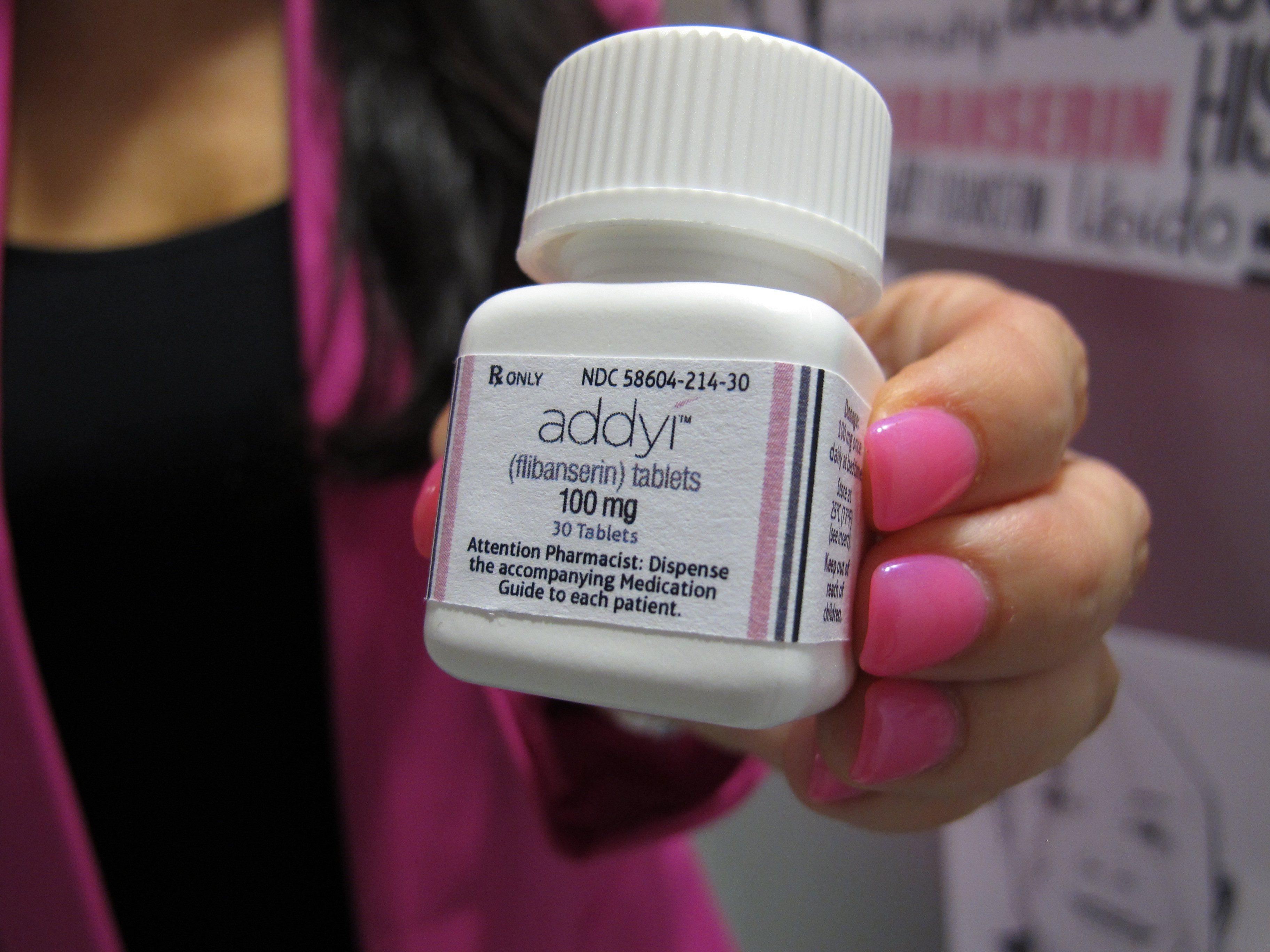 FILE - In this Aug. 18, 2015 file photo, Sprout Pharmaceuticals CEO Cindy Whitehead holds a bottle for the female sex-drive drug Addyi in Raleigh, N.C. (AP Photo/Allen G. Breed, File)
